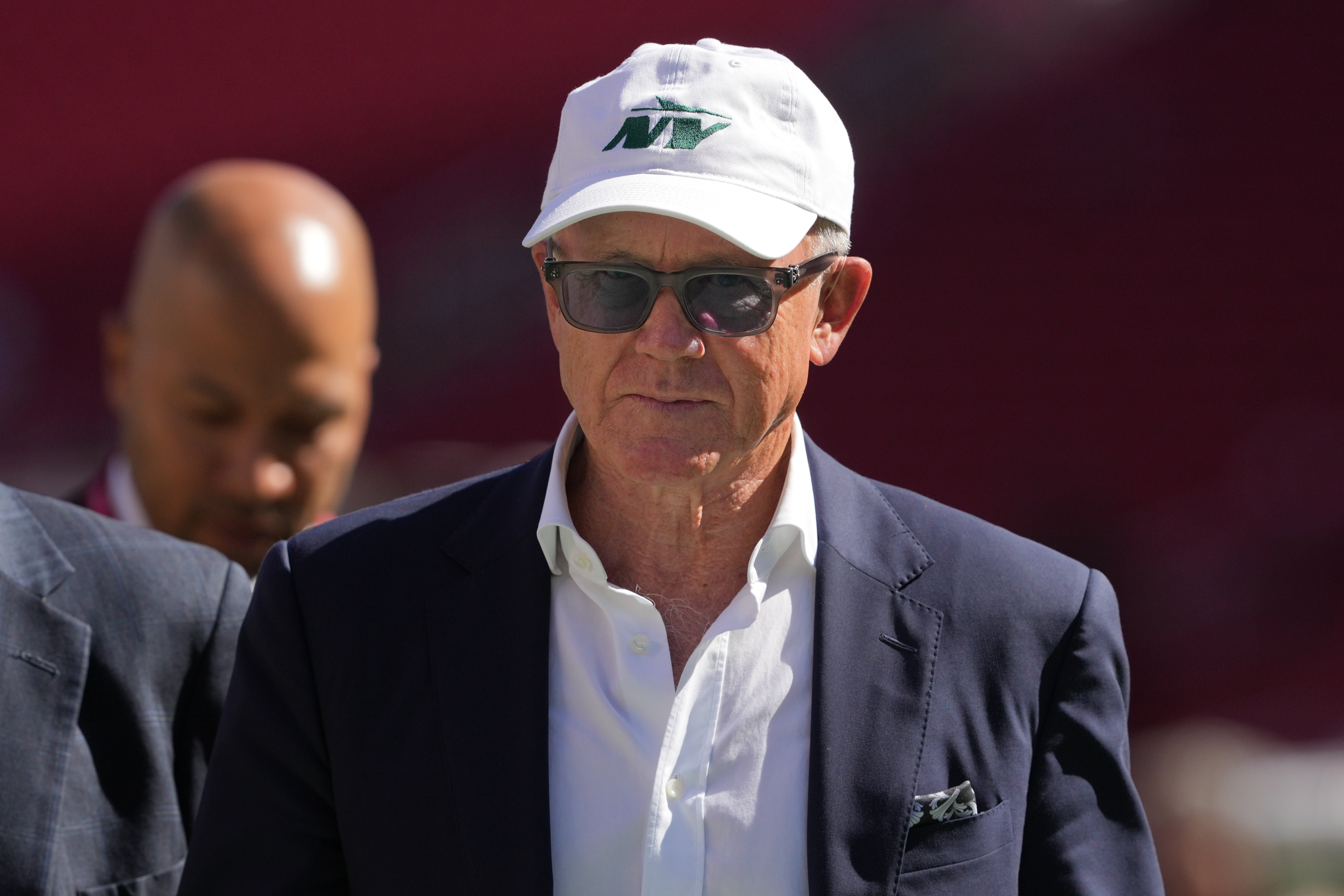 New York Jets owner Woody Johnson walks on the field before the game against the San Francisco 49ers at Levi's Stadium.