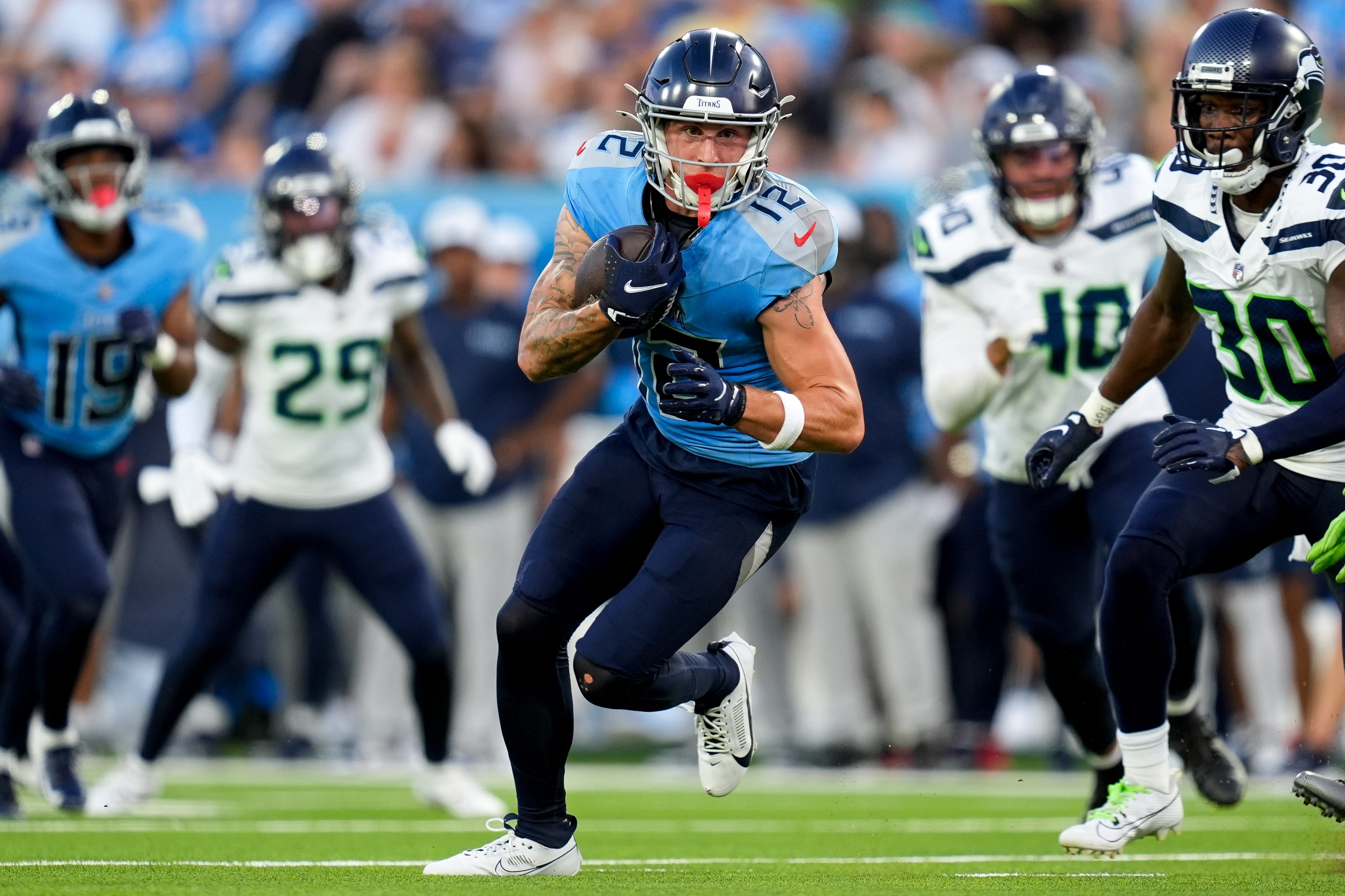 Tennessee Titans wide receiver Mason Kinsey (12) runs the ball against the Seattle Seahawks during the second quarter at Nissan Stadium in Nashville, Tenn., Saturday, Aug. 17, 2024 Andrew Nelles / The Tennessean-USA TODAY NETWORK