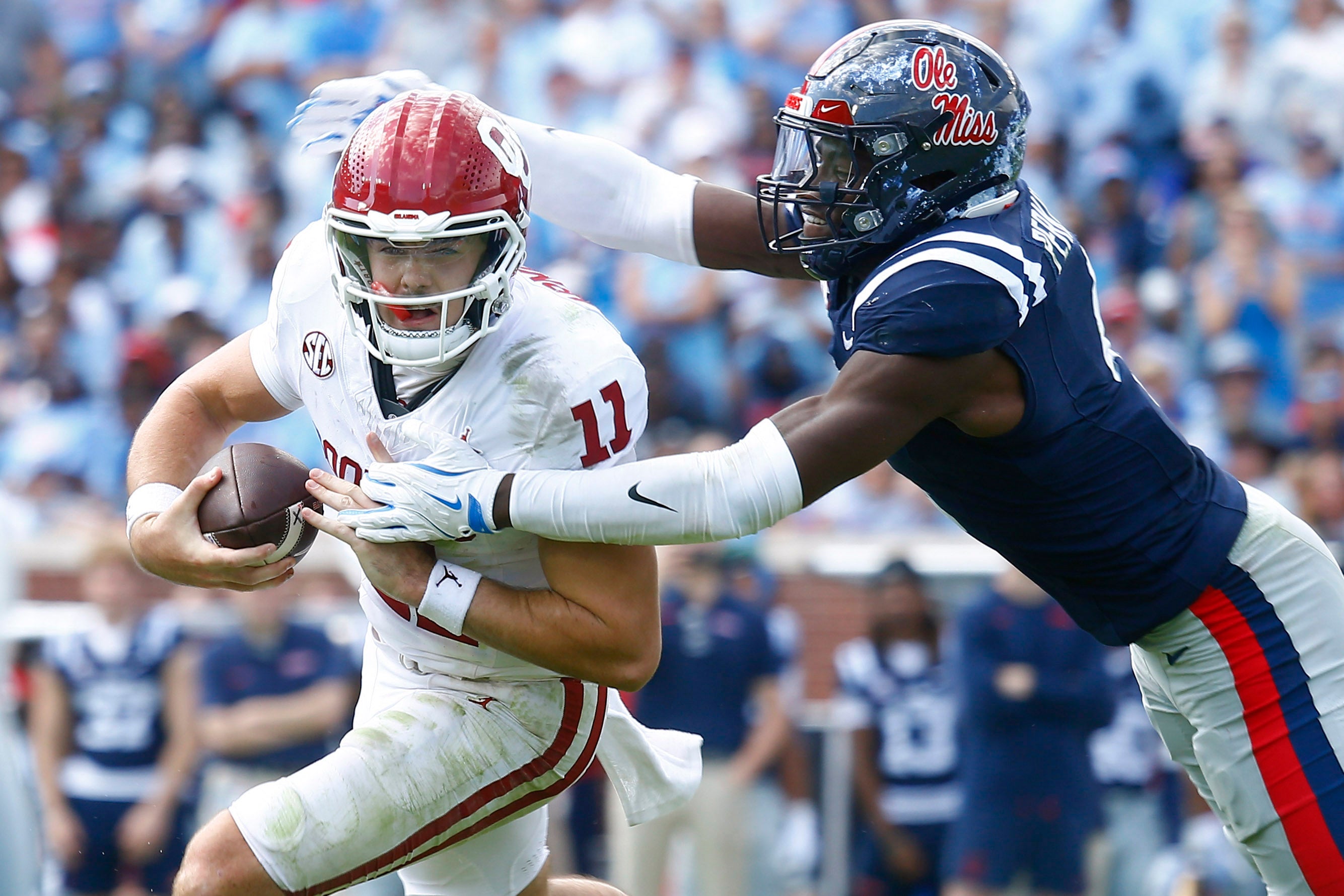 Oct 26, 2024; Oxford, Mississippi, USA; Mississippi Rebels linebacker Suntarine Perkins (4) sacks Oklahoma Sooners quarterback Jackson Arnold (11) during the first half at Vaught-Hemingway Stadium.