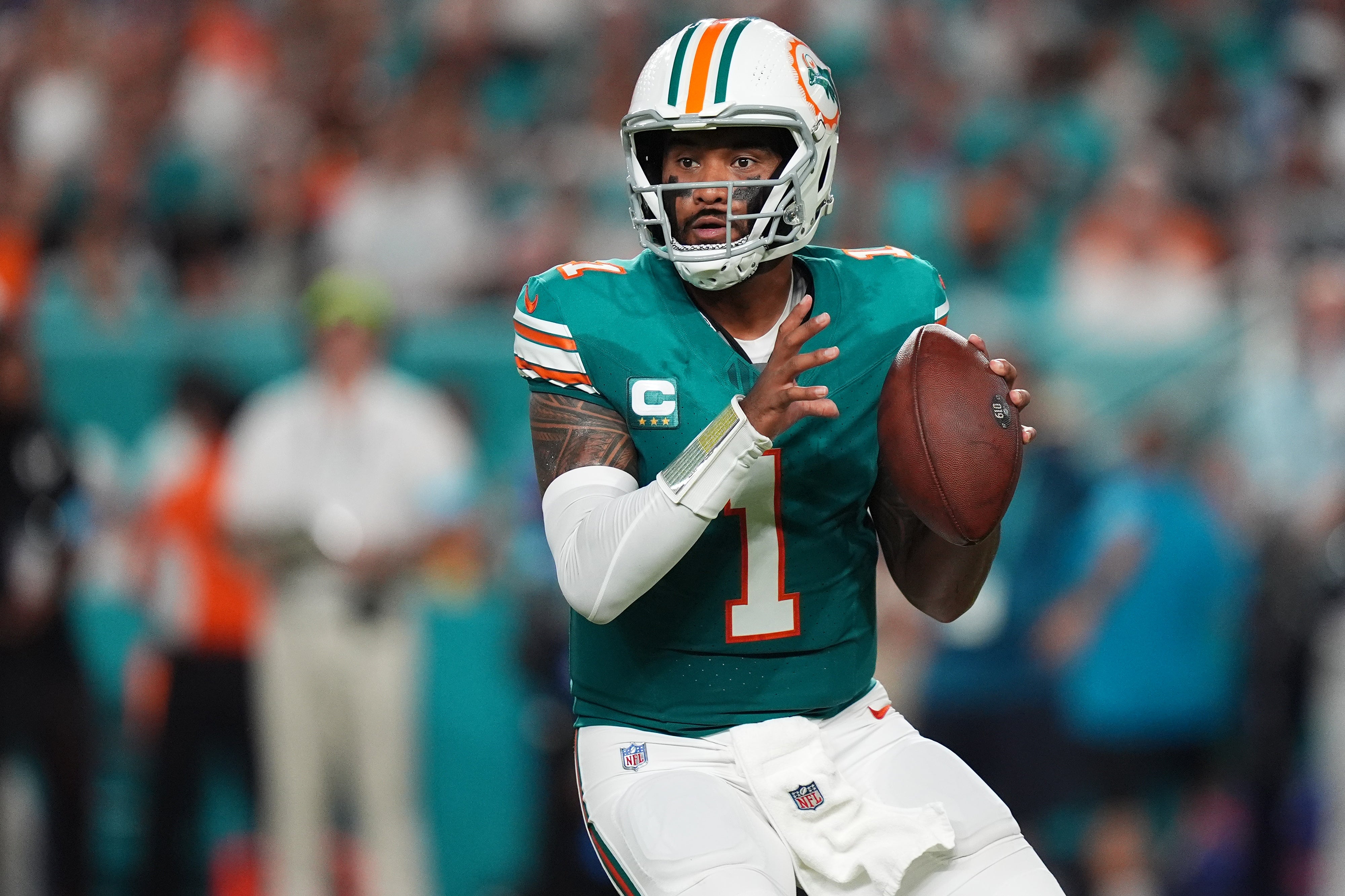 Sep 12, 2024; Miami Gardens, Florida, USA; Miami Dolphins quarterback Tua Tagovailoa (1) drops back with the ball against the Buffalo Bills during the first half at Hard Rock Stadium.