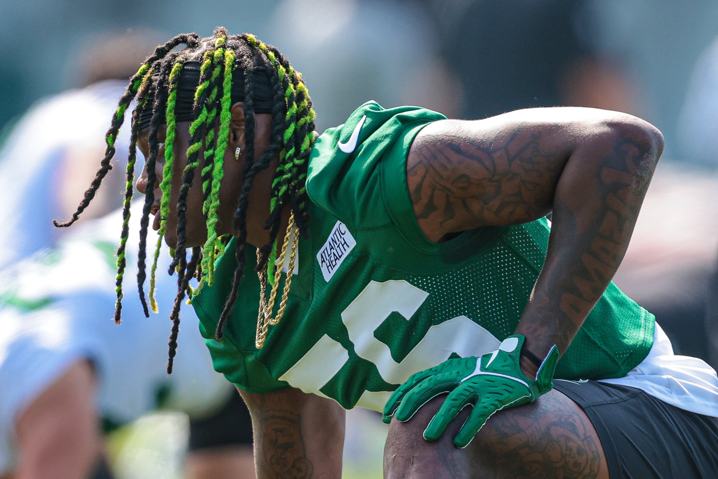 New York Jets linebacker Quincy Williams (56) stretches during training camp at Atlantic Health Jets Training Center.