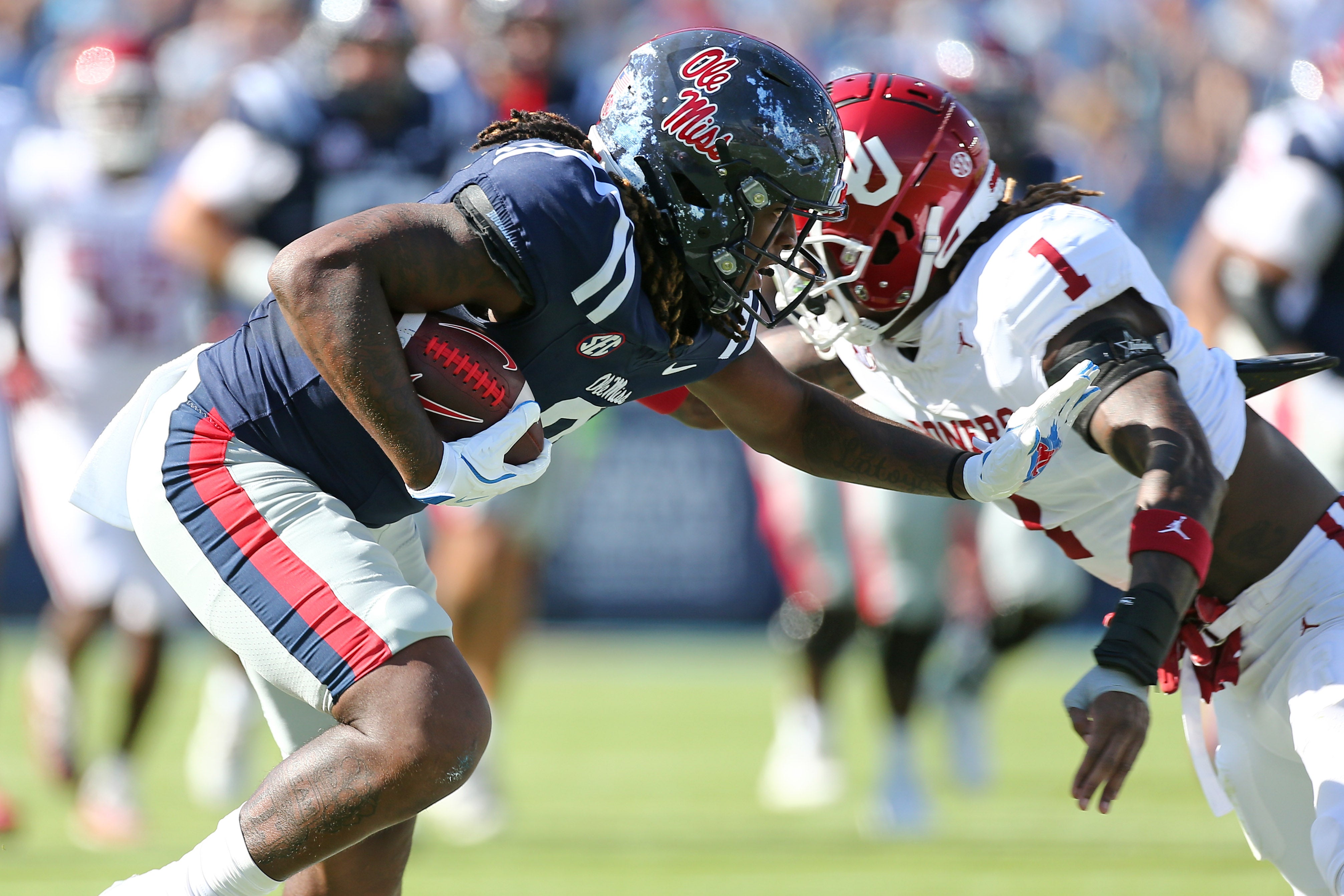 Oct 26, 2024; Oxford, Mississippi, USA; Mississippi Rebels tight end Dae'Quan Wright (8) runs after a catch as Oklahoma Sooners linebacker Dasan McCullough (1) makes the tackle during the first half at Vaught-Hemingway Stadium.