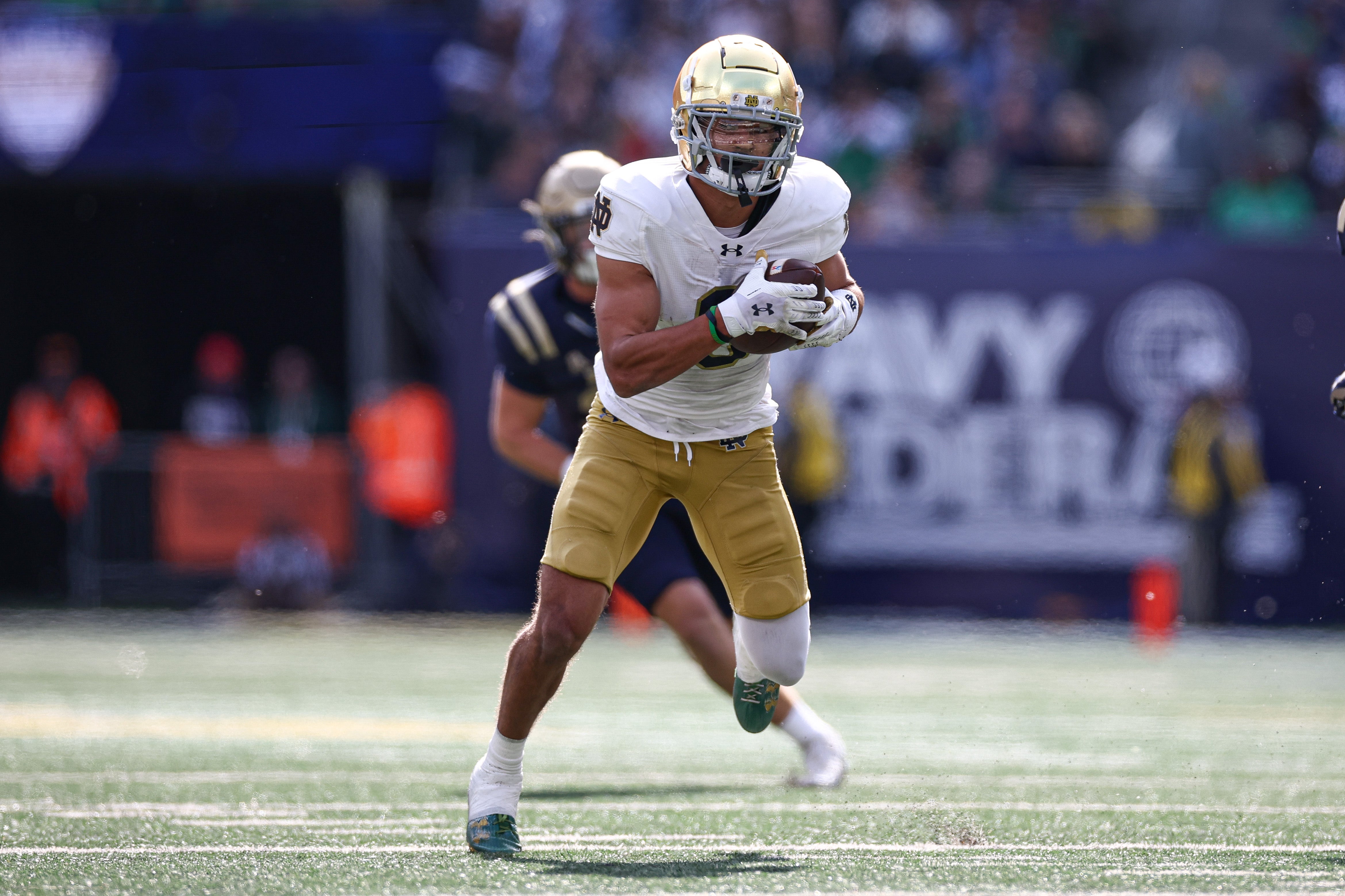 Notre Dame Fighting Irish wide receiver Jordan Faison (6) gains yards after catch during the first half against the Navy Midshipmen at MetLife Stadium.