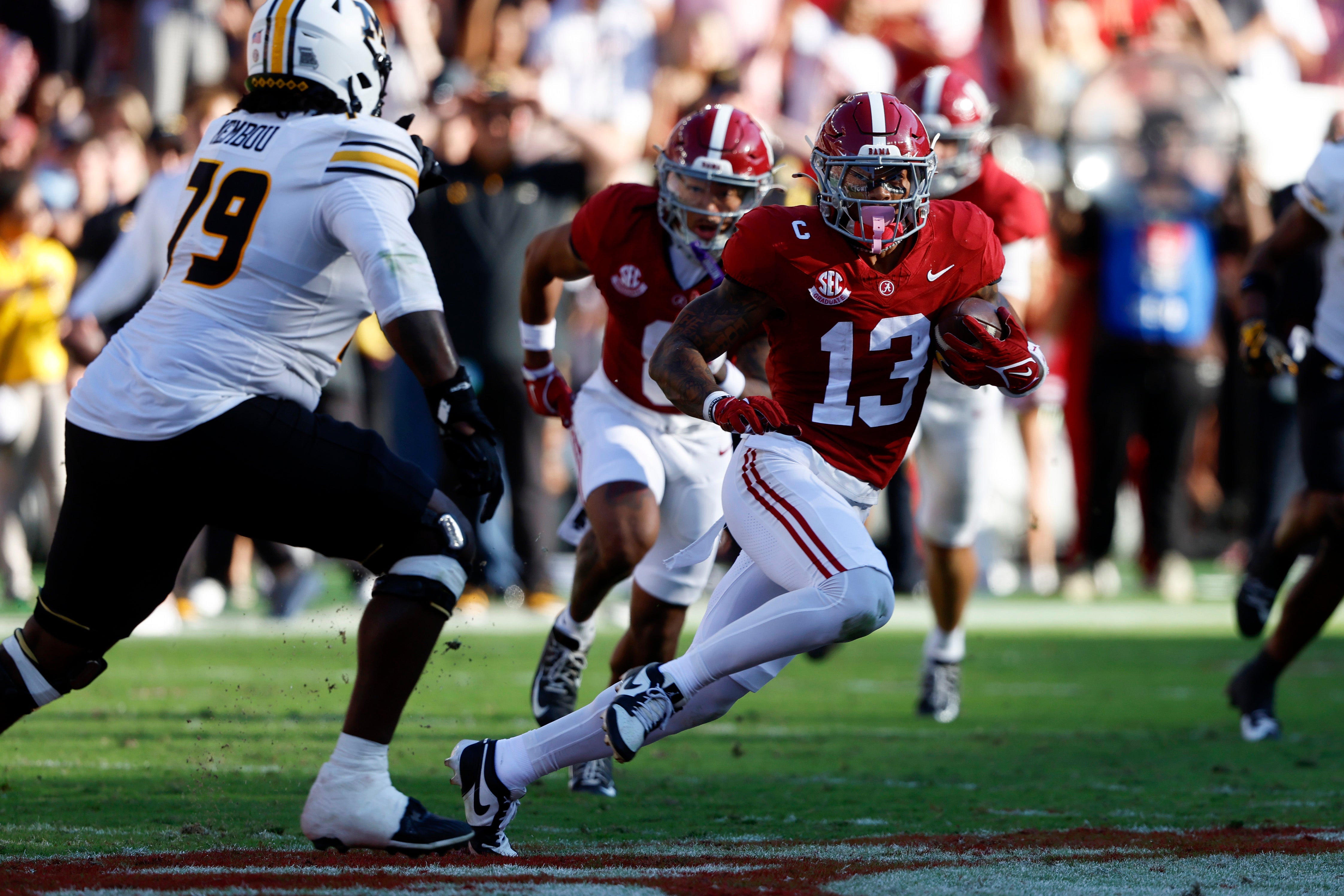 Oct 26, 2024; Tuscaloosa, Alabama, USA; Alabama Crimson Tide defensive back Malachi Moore (13) carries the ball after an interception against the Missouri Tigers during the first half at Bryant-Denny Stadium.