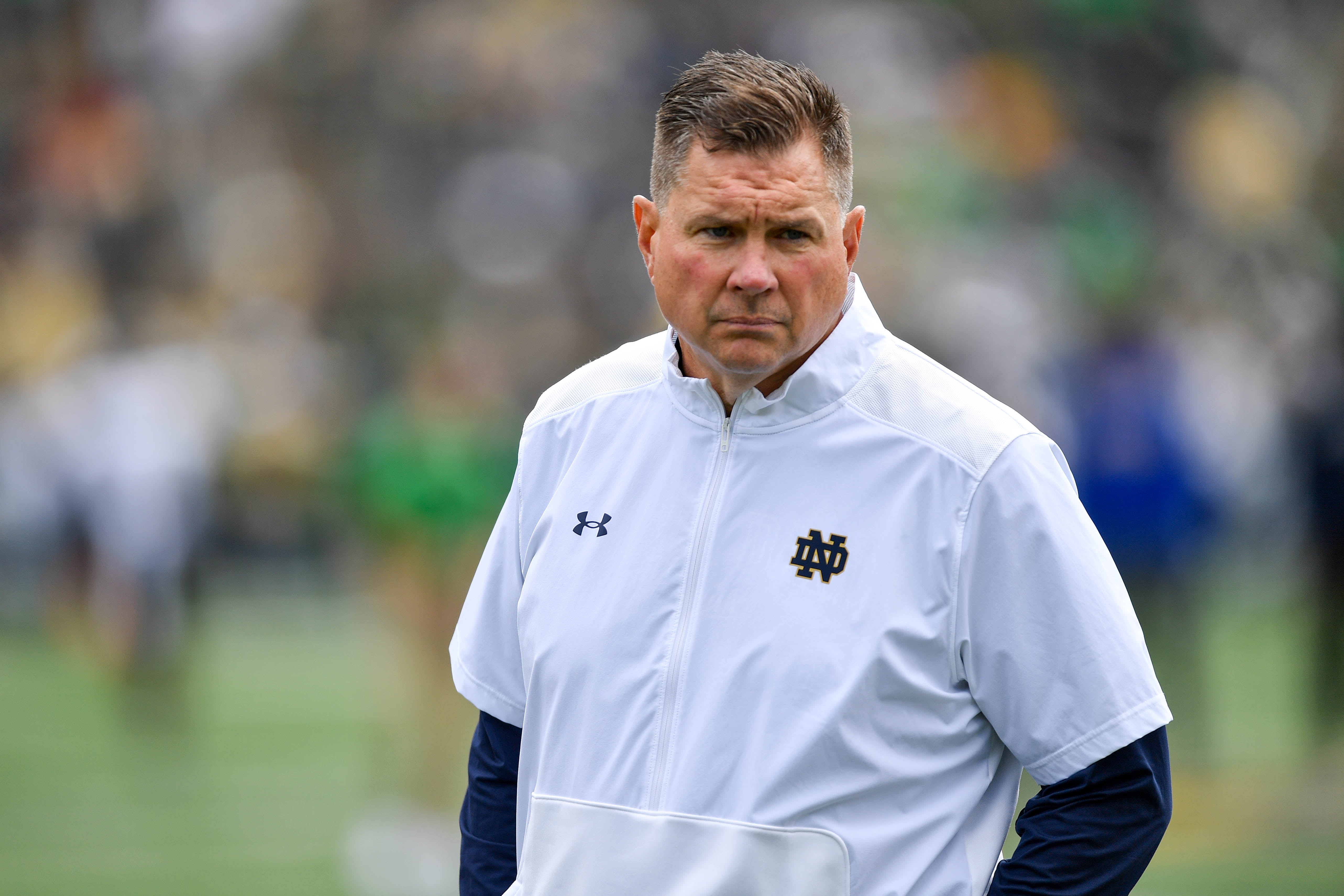 Notre Dame Fighting Irish Defensive Coordinator Al Golden watches warnups before the game against the Northern Illinois Huskies at Notre Dame Stadium.