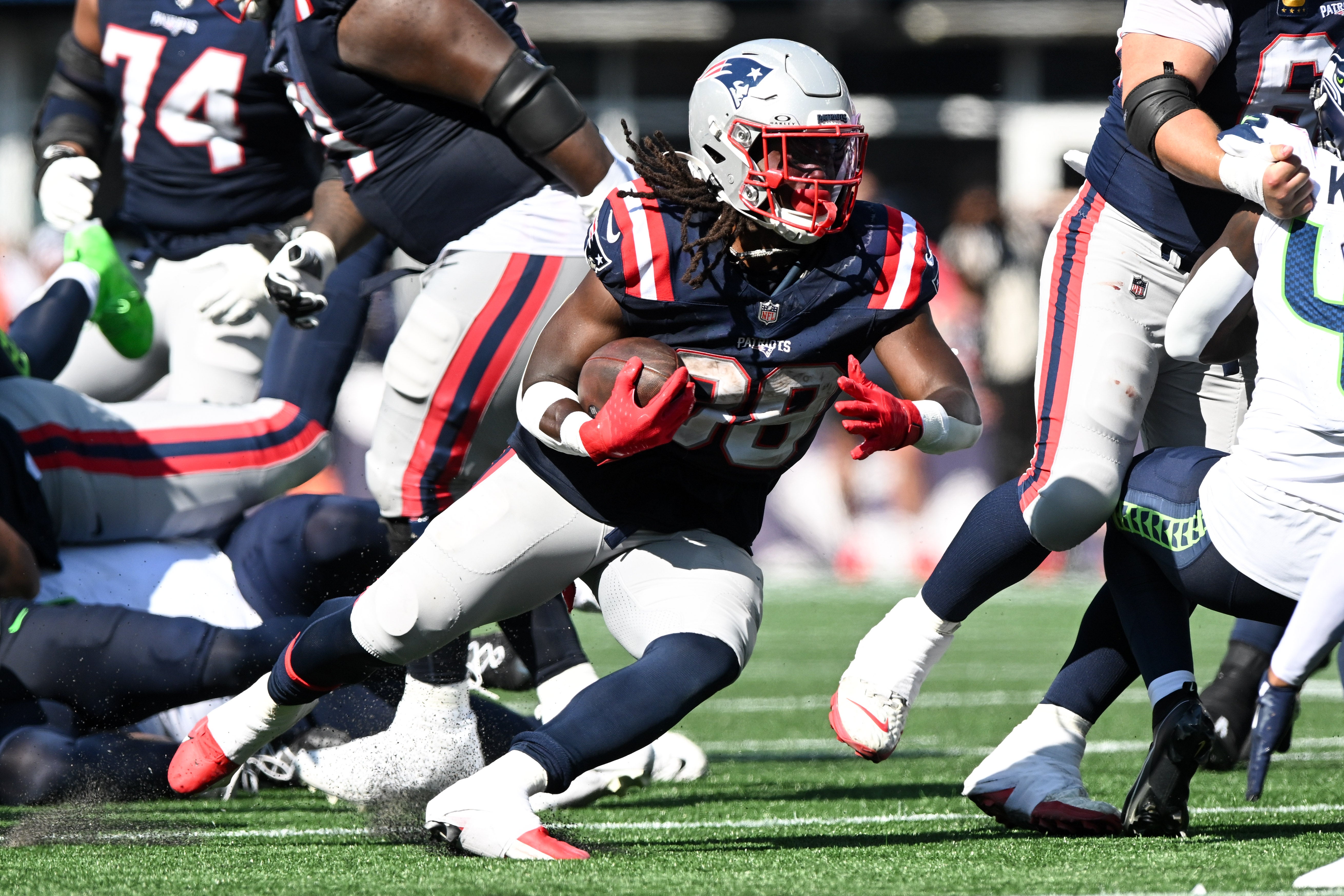Sep 15, 2024; Foxborough, Massachusetts, USA; New England Patriots running back Rhamondre Stevenson (38) runs with the ball against the Seattle Seahawks during the second half at Gillette Stadium