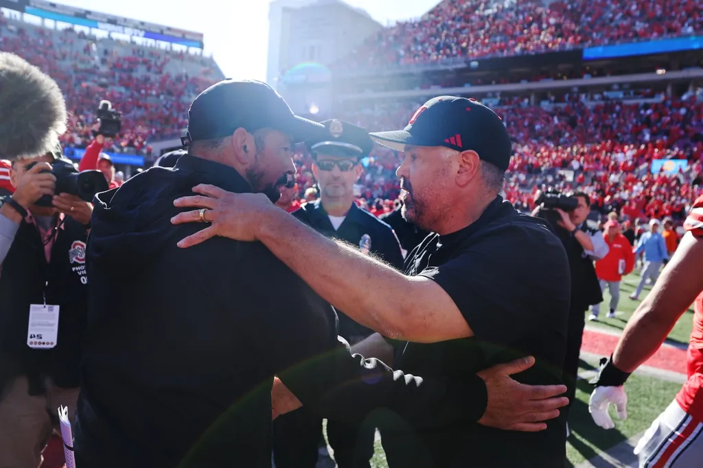 Ohio State Buckeyes head coach Ryan Day and Nebraska Cornhuskers head coach Matt Rhule meet at midfield after the game at Ohio Stadium.