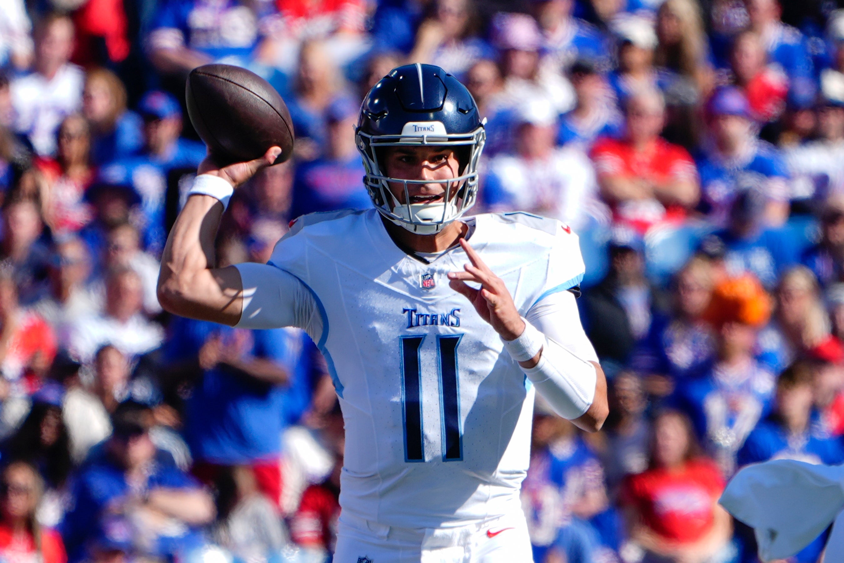 Oct 20, 2024; Orchard Park, New York, USA; Tennessee Titans quarterback Mason Rudolph (11) throws the ball against the Buffalo Bills during the first half at Highmark Stadium. Mandatory Credit: Gregory Fisher-Imagn Images