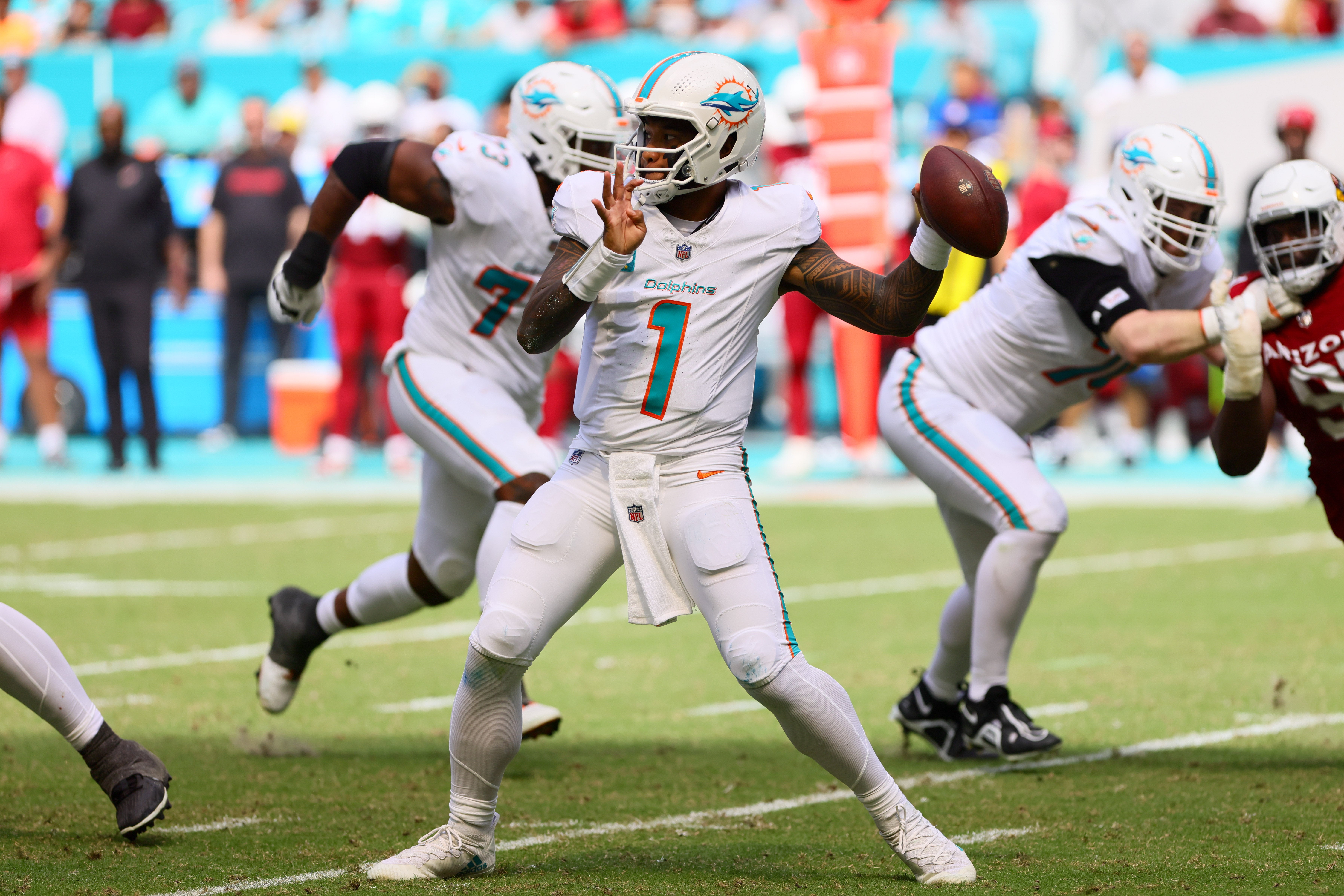 Oct 27, 2024; Miami Gardens, Florida, USA; Miami Dolphins quarterback Tua Tagovailoa (1) throws the football against the Arizona Cardinals during the second quarter at Hard Rock Stadium.