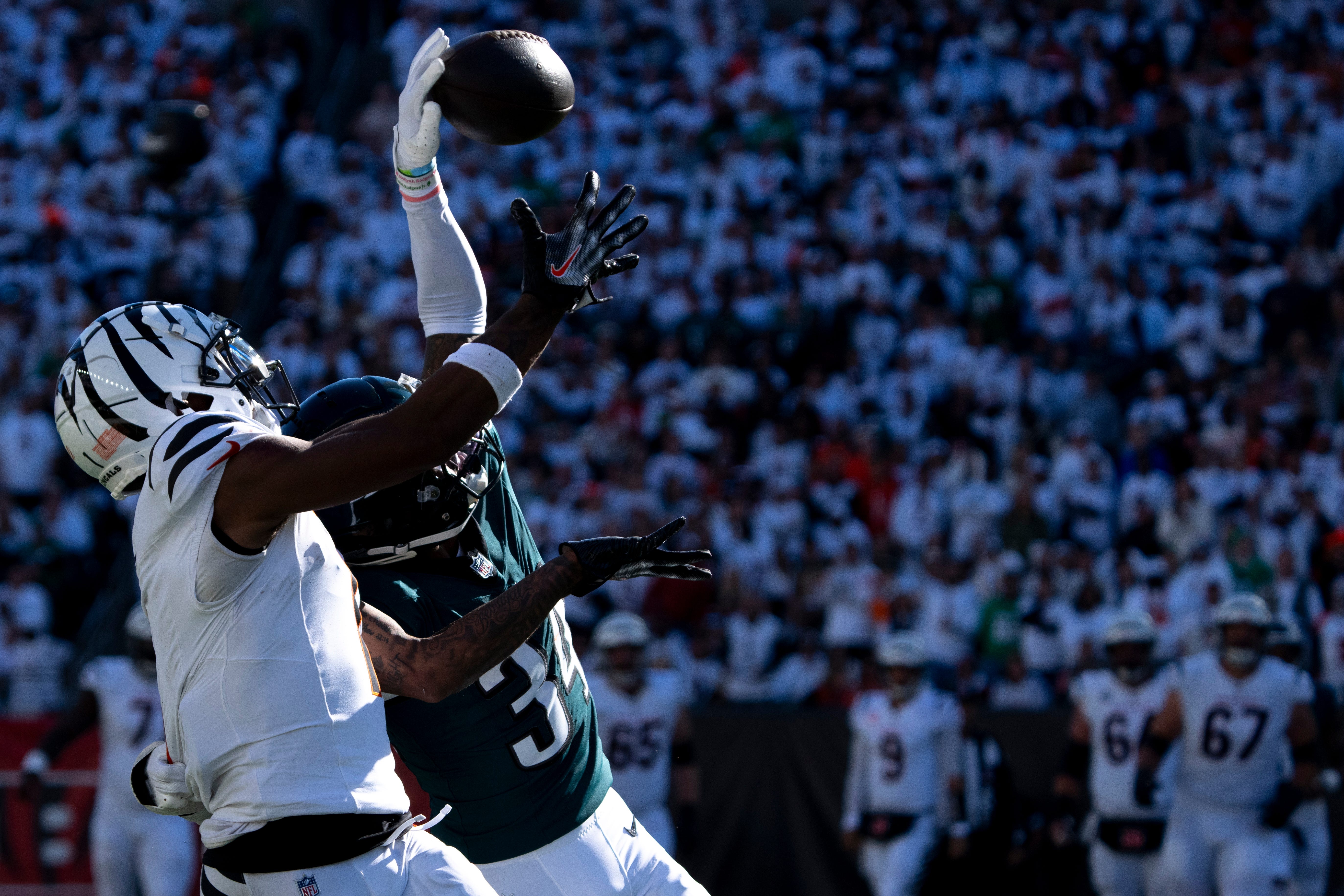 Philadelphia Eagles cornerback Isaiah Rodgers (34) tips a pass intended for Cincinnati Bengals wide receiver Ja'Marr Chase (1) before Philadelphia Eagles safety C.J. Gardner-Johnson (8) intercepts it.