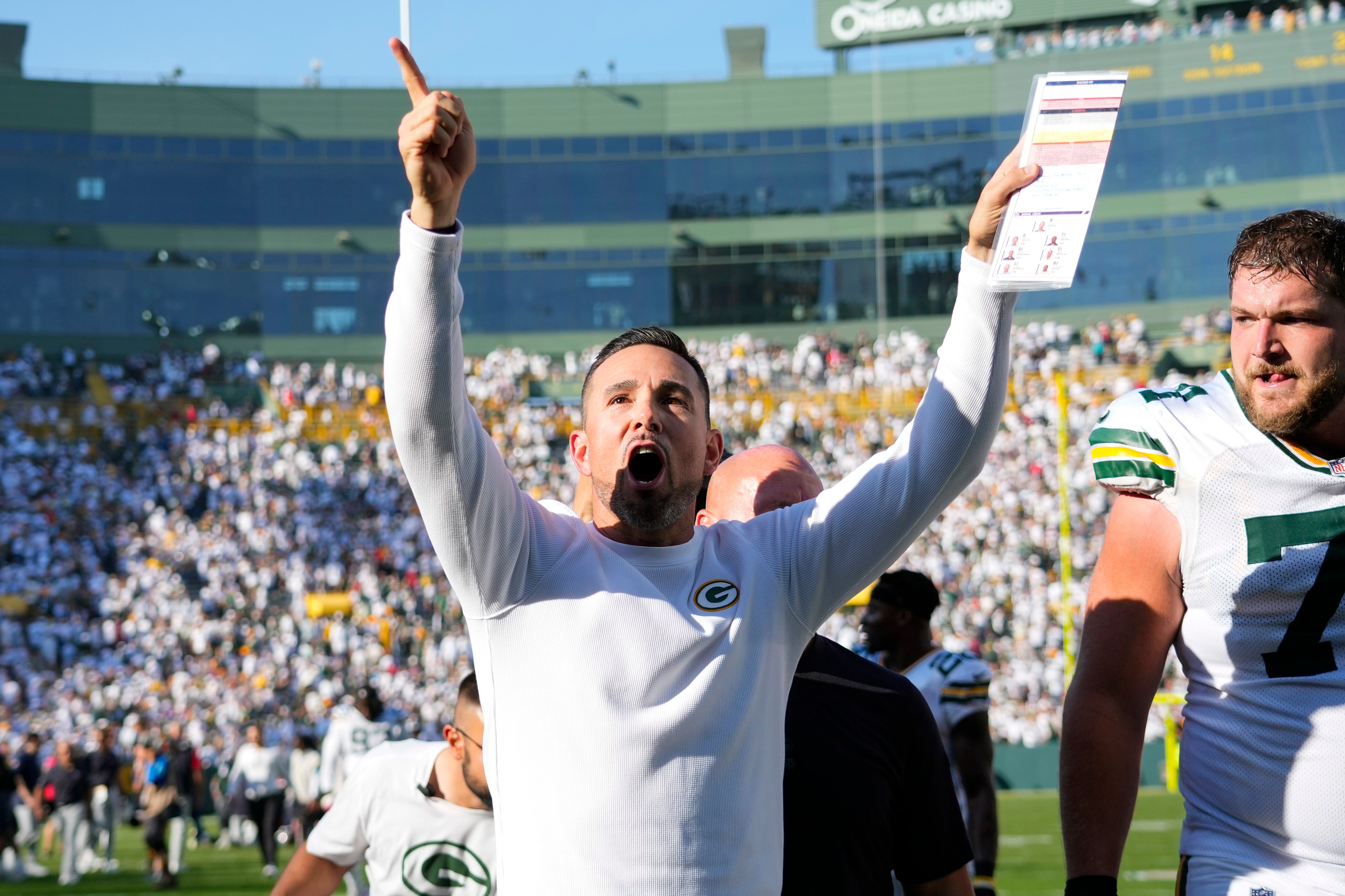 Green Bay Packers head coach Matt LaFleur celebrates while walking off the field following the game against the Houston Texans at Lambeau Field.