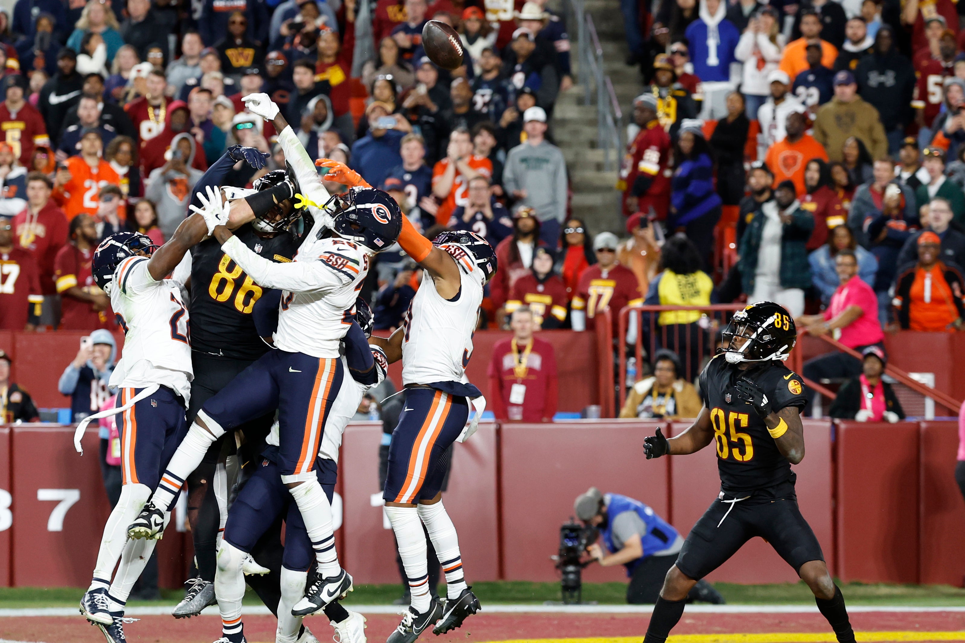 Oct 27, 2024; Landover, Maryland, USA; Washington Commanders wide receiver Noah Brown (85) prepares to catch a game-winnning Hail Mary pass on the final play of the game against the Chicago Bears at Northwest Stadium.