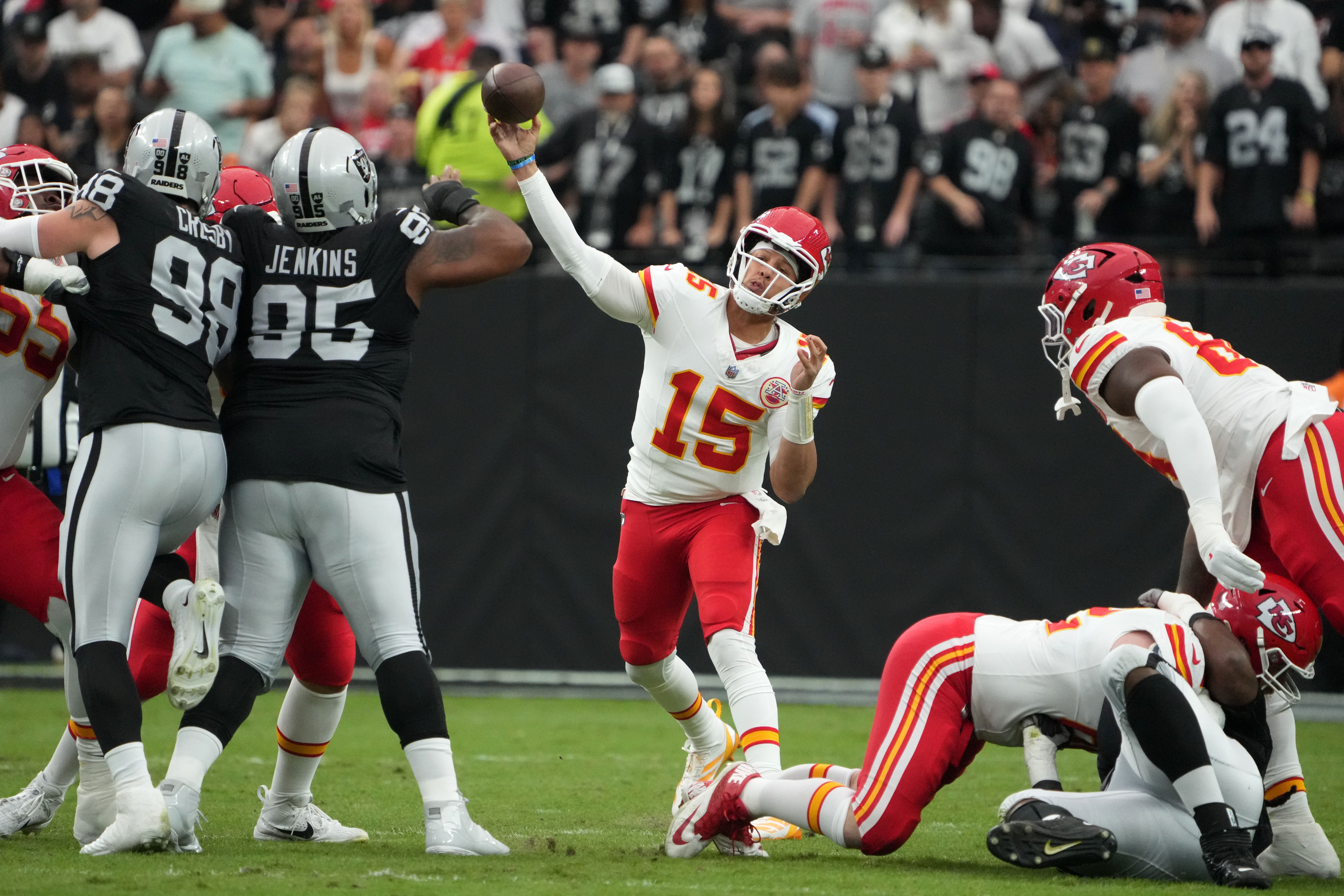 Chiefs quarterback Patrick Mahomes (15) throws the ball against the Las Vegas Raiders