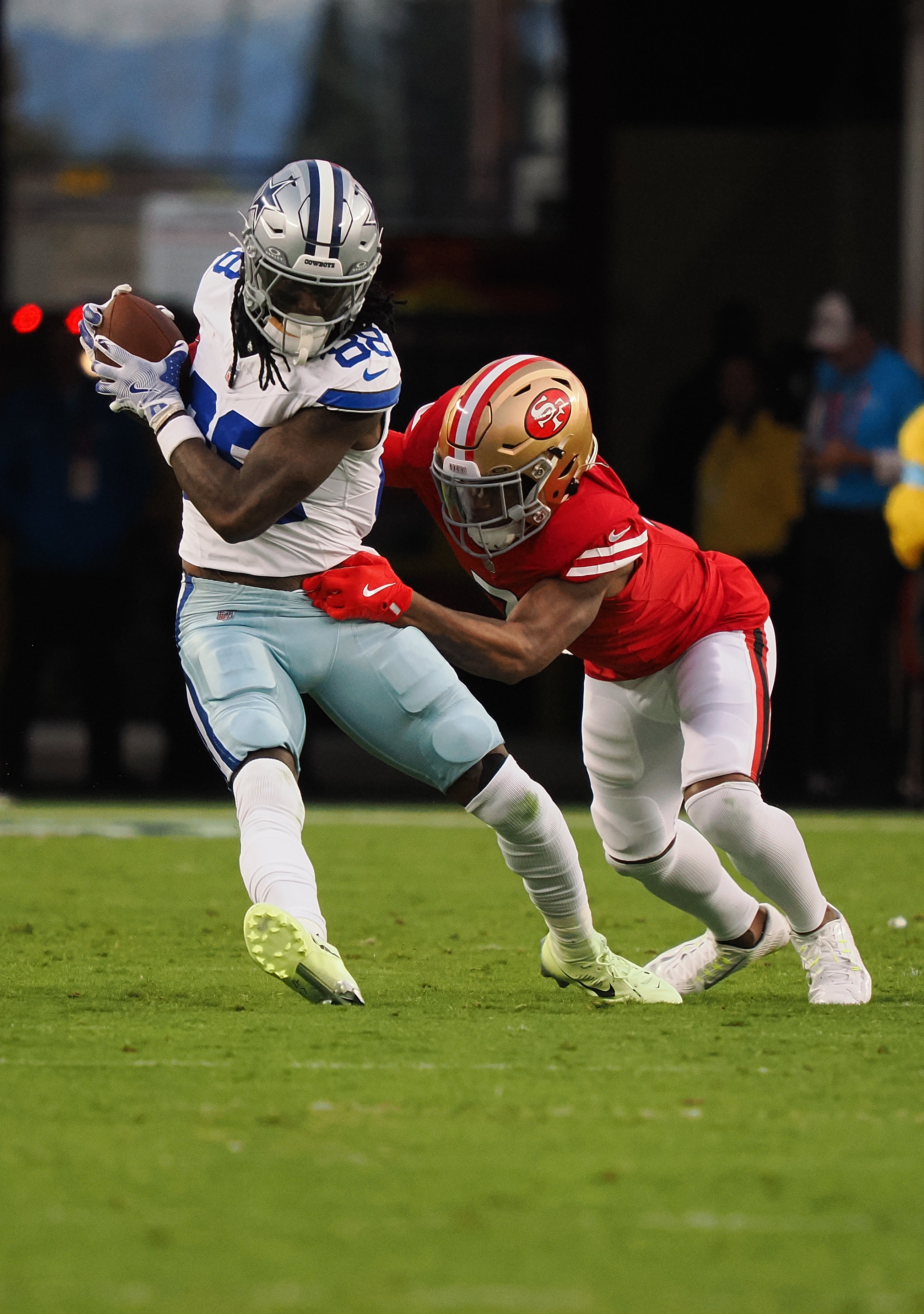 Oct 27, 2024; Santa Clara, California, USA; Dallas Cowboys wide receiver CeeDee Lamb (88) carries the ball against San Francisco 49ers cornerback Charvarius Ward (7) during eh first quarter at Levi's Stadium.