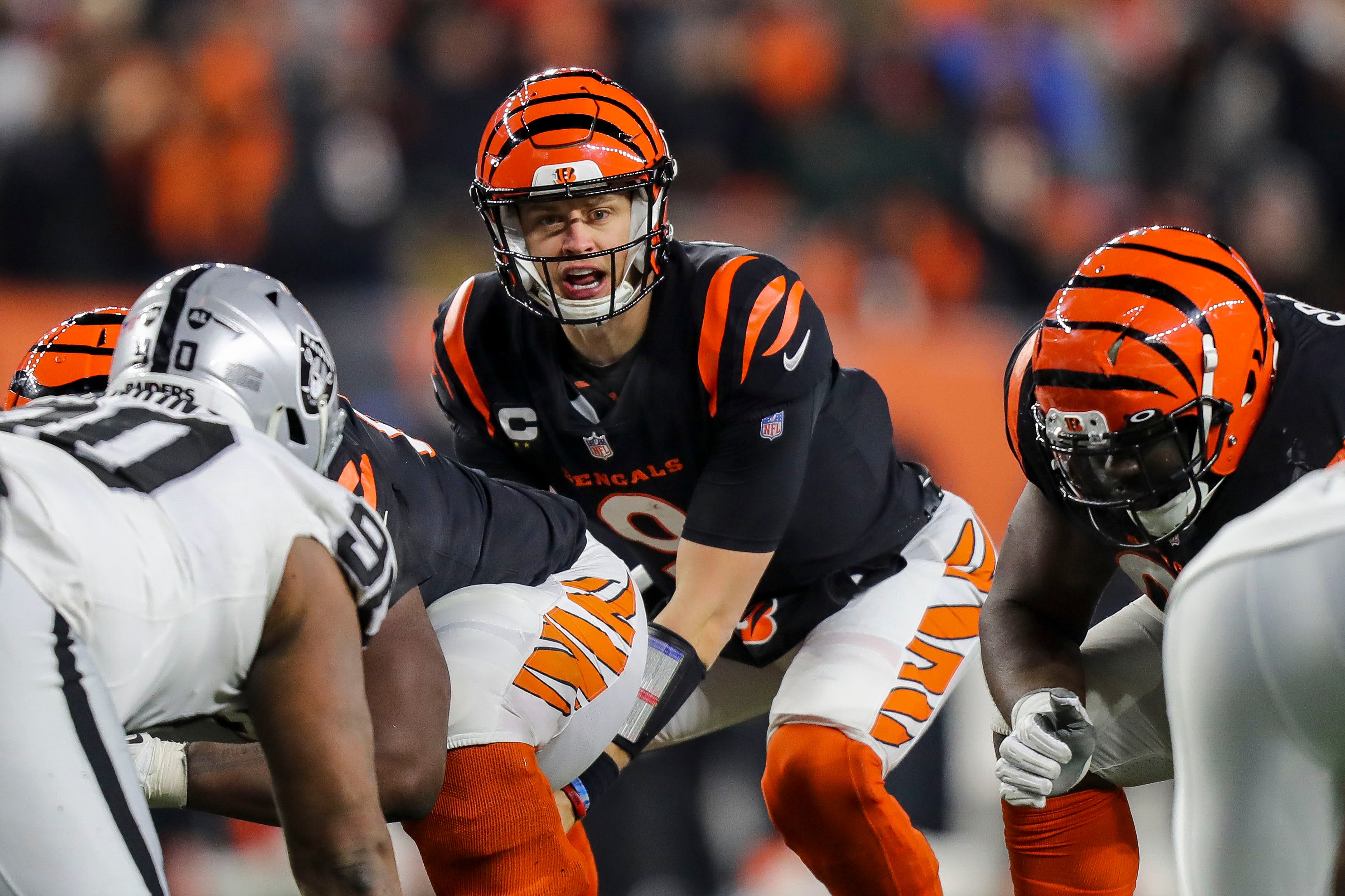 Jan 15, 2022; Cincinnati, Ohio, USA; Cincinnati Bengals quarterback Joe Burrow (9) calls a play against the Las Vegas Raiders in the second half in an AFC Wild Card playoff football game at Paul Brown Stadium.
