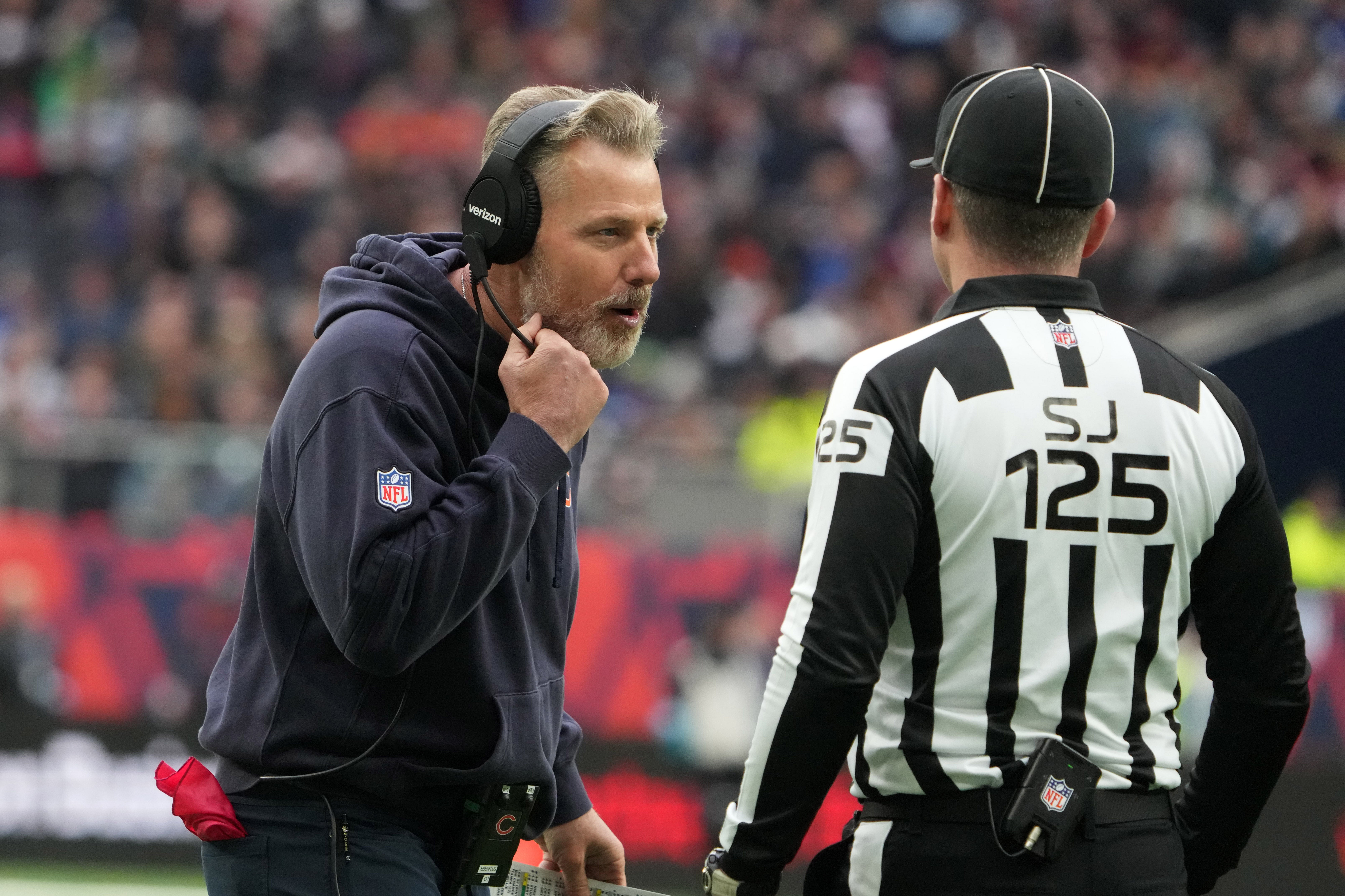 Oct 13, 2024; London, United Kingdom; Chicago Bears coach Matt Eberflus talks with side judge Chad Hill (125) against the Jacksonville Jaguars in the second half during an NFL International Series game at Tottenham Hotspur Stadium.