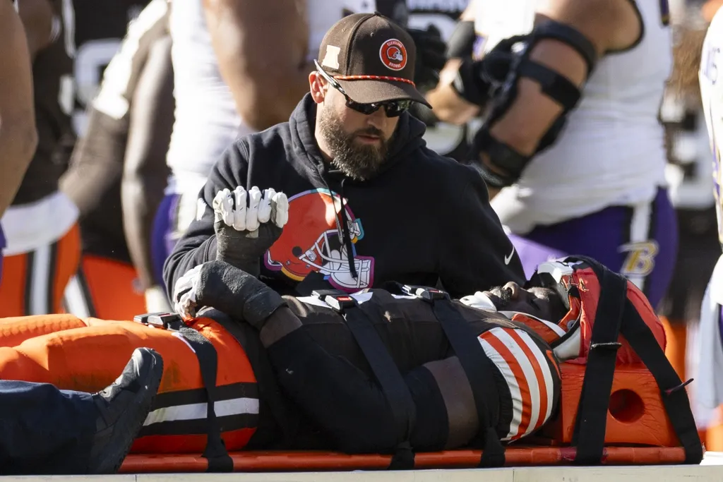 Cleveland Browns linebacker Jeremiah Owusu-Koramoah (6) lays on the medical cart after an injury during the third quarter against the Baltimore Ravens at Huntington Bank Field.