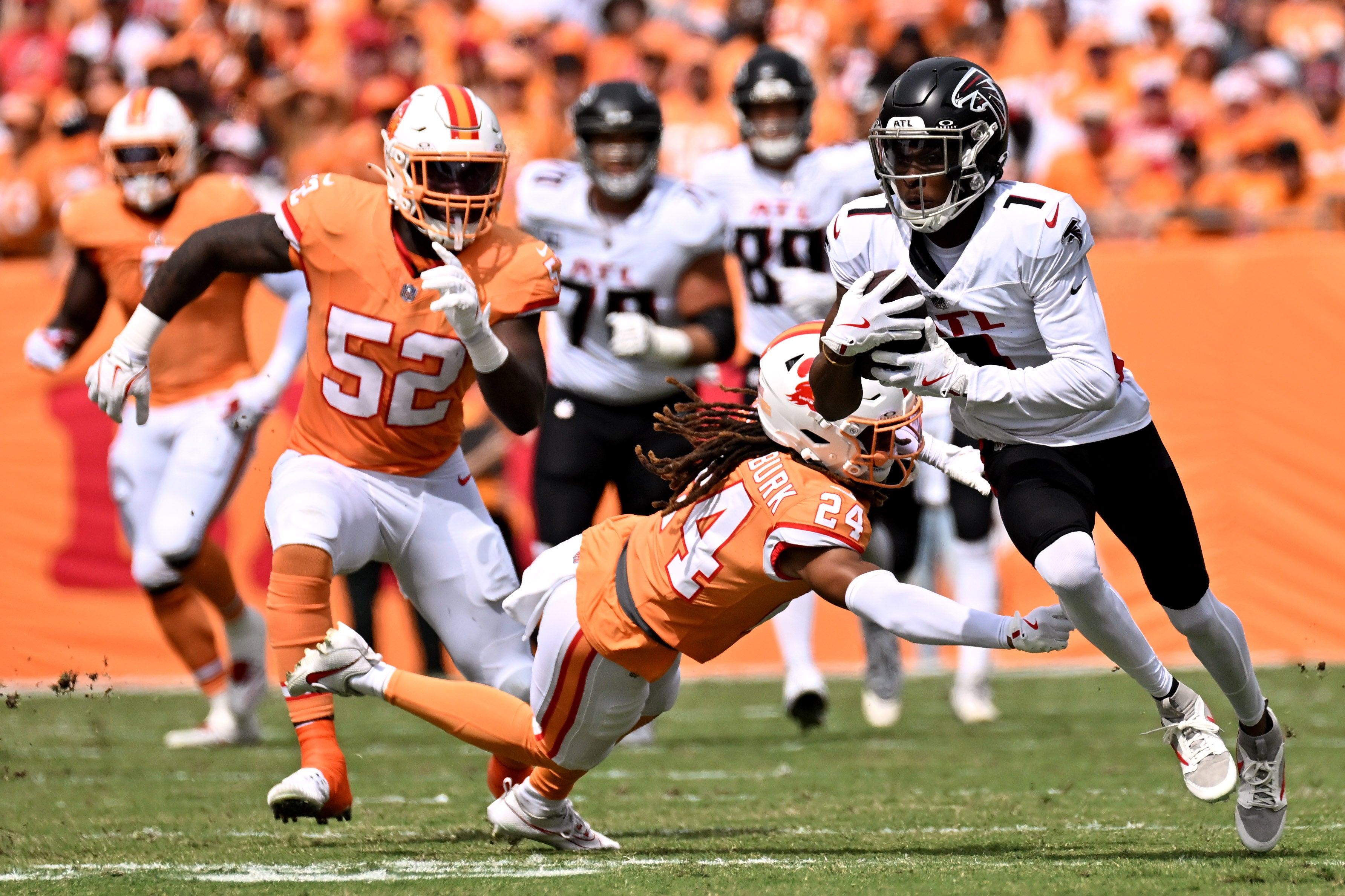 Oct 27, 2024; Tampa, Florida, USA; Atlanta Falcons wide receiver Darnell Mooney (1) gets past Tampa Bay Buccaneers defensive back Tyrek Funderbunk (24) in the first half at Raymond James Stadium.