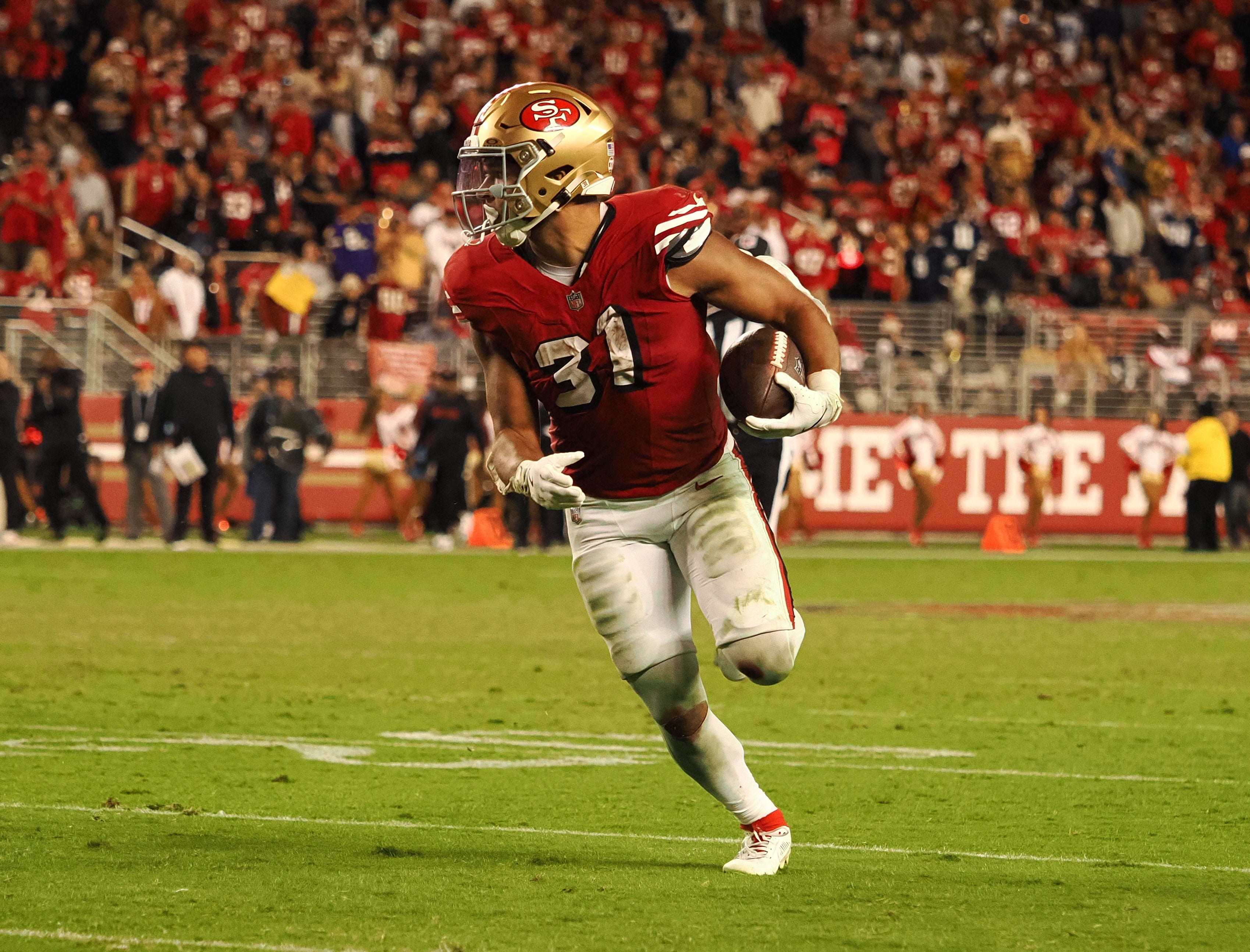 San Francisco 49ers running back Isaac Guerendo (31) carries the ball against the Dallas Cowboys during the fourth quarter at Levi's Stadium. Mandatory Credit: