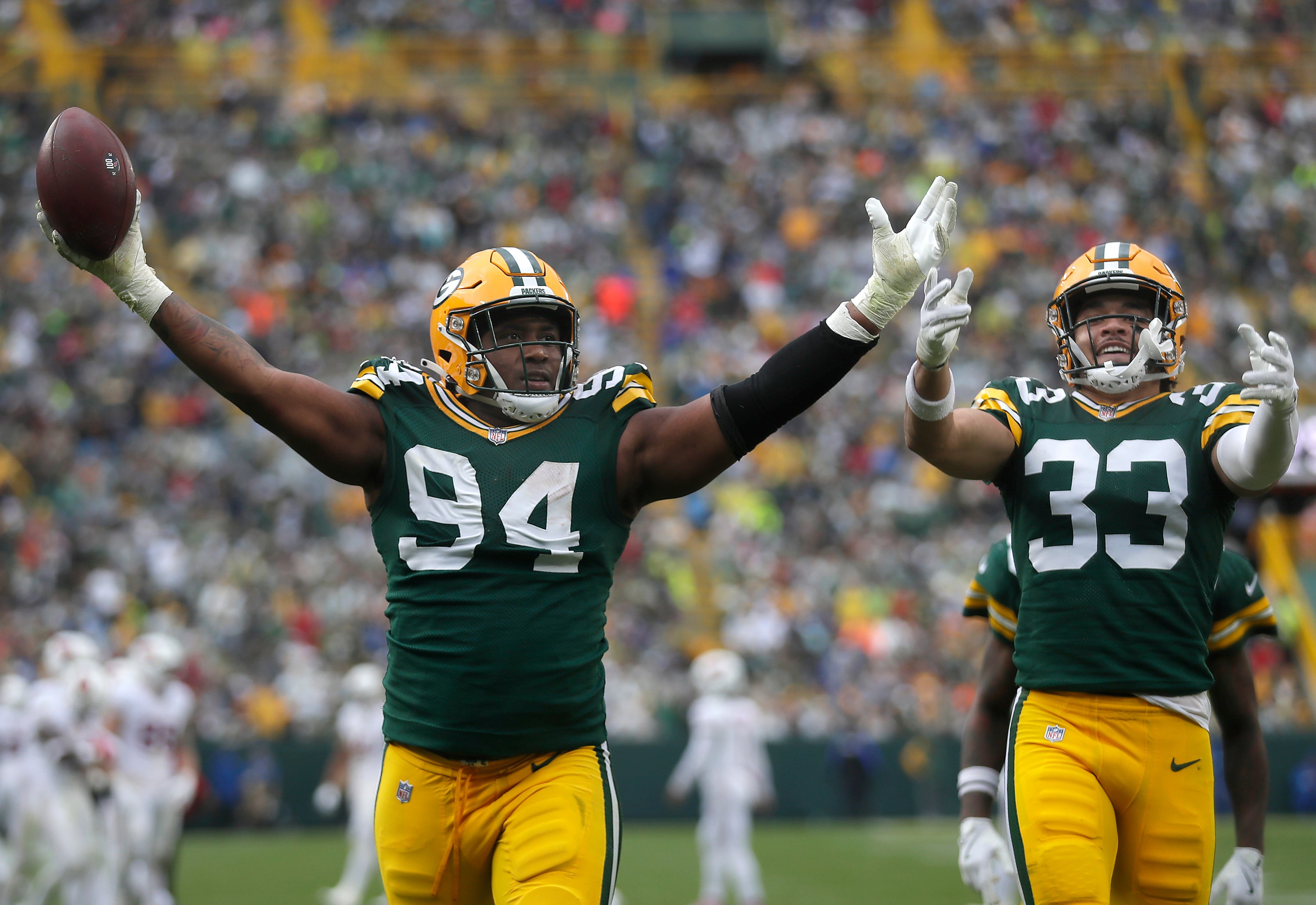 Green Bay Packers defensive lineman Karl Brooks (94) celebrates a touchdown in the second half against the Arizona Cardinals at Lambeau Field.