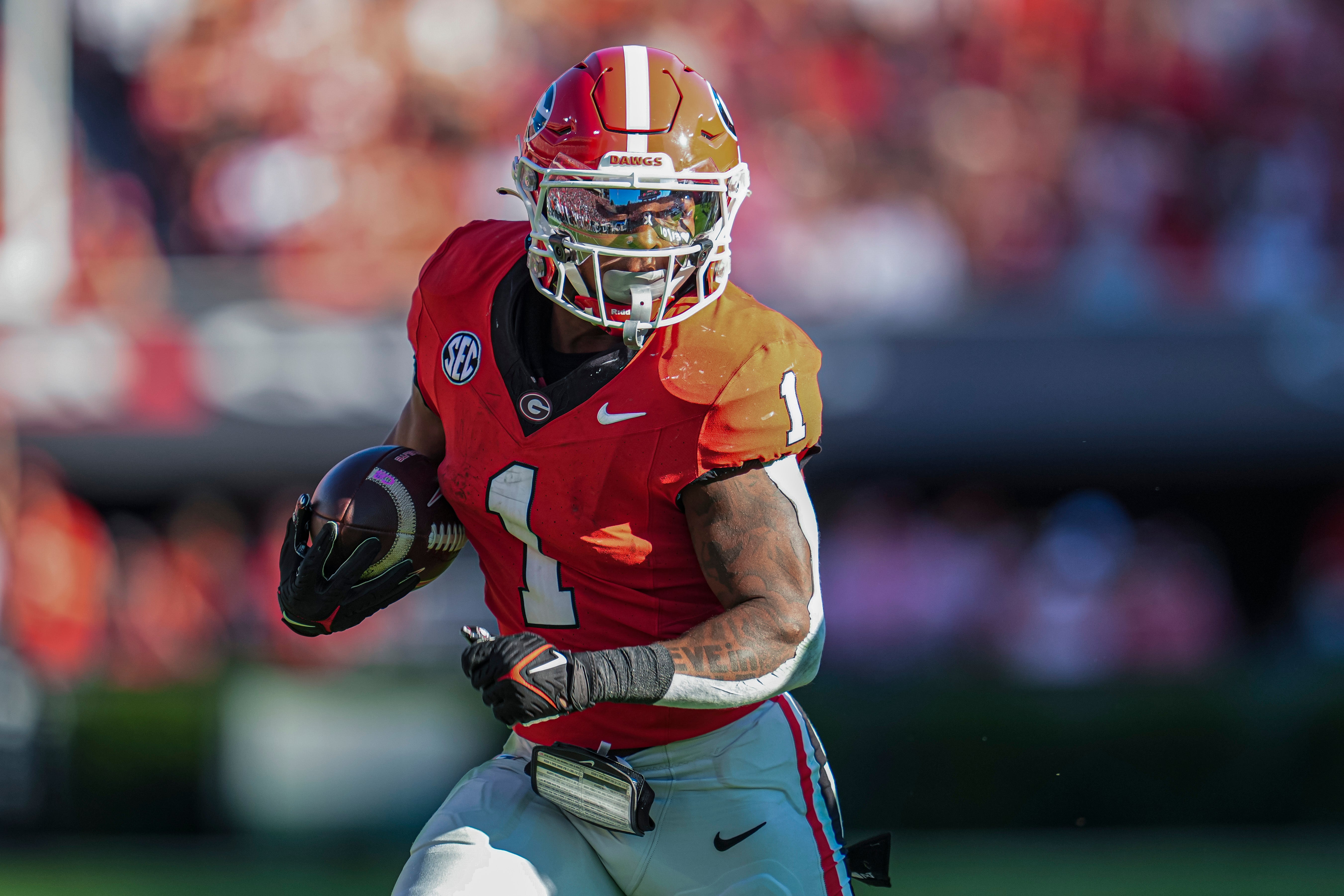 Georgia Bulldogs running back Trevor Etienne (1) runs with the ball against the Mississippi State Bulldogs at Sanford Stadium.