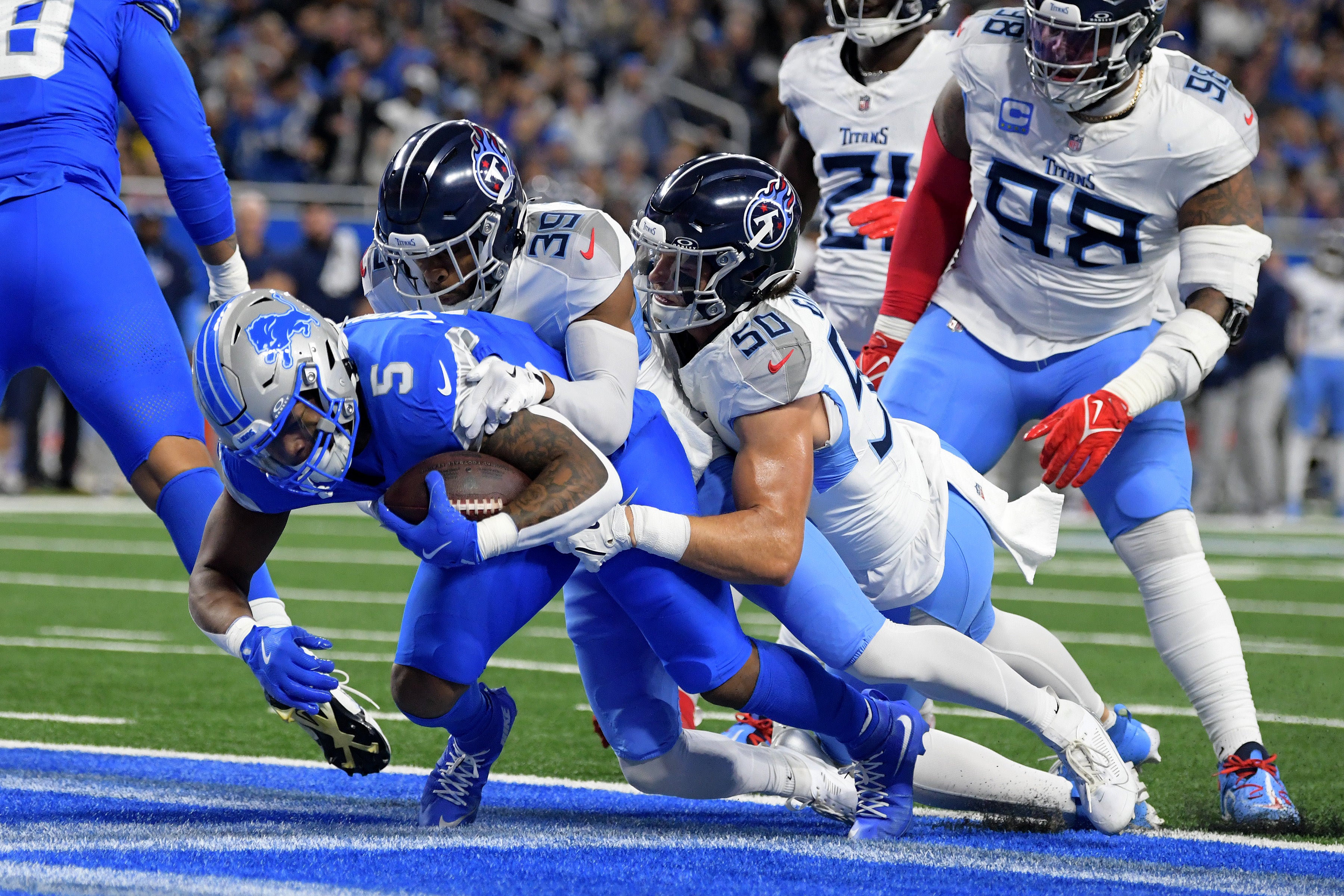Oct 27, 2024; Detroit, Michigan, USA; Detroit Lions running back David Montgomery (5) scores a touchdown against the Tennessee Titans in the first quarter at Ford Field. Mandatory Credit: Lon Horwedel-Imagn Images