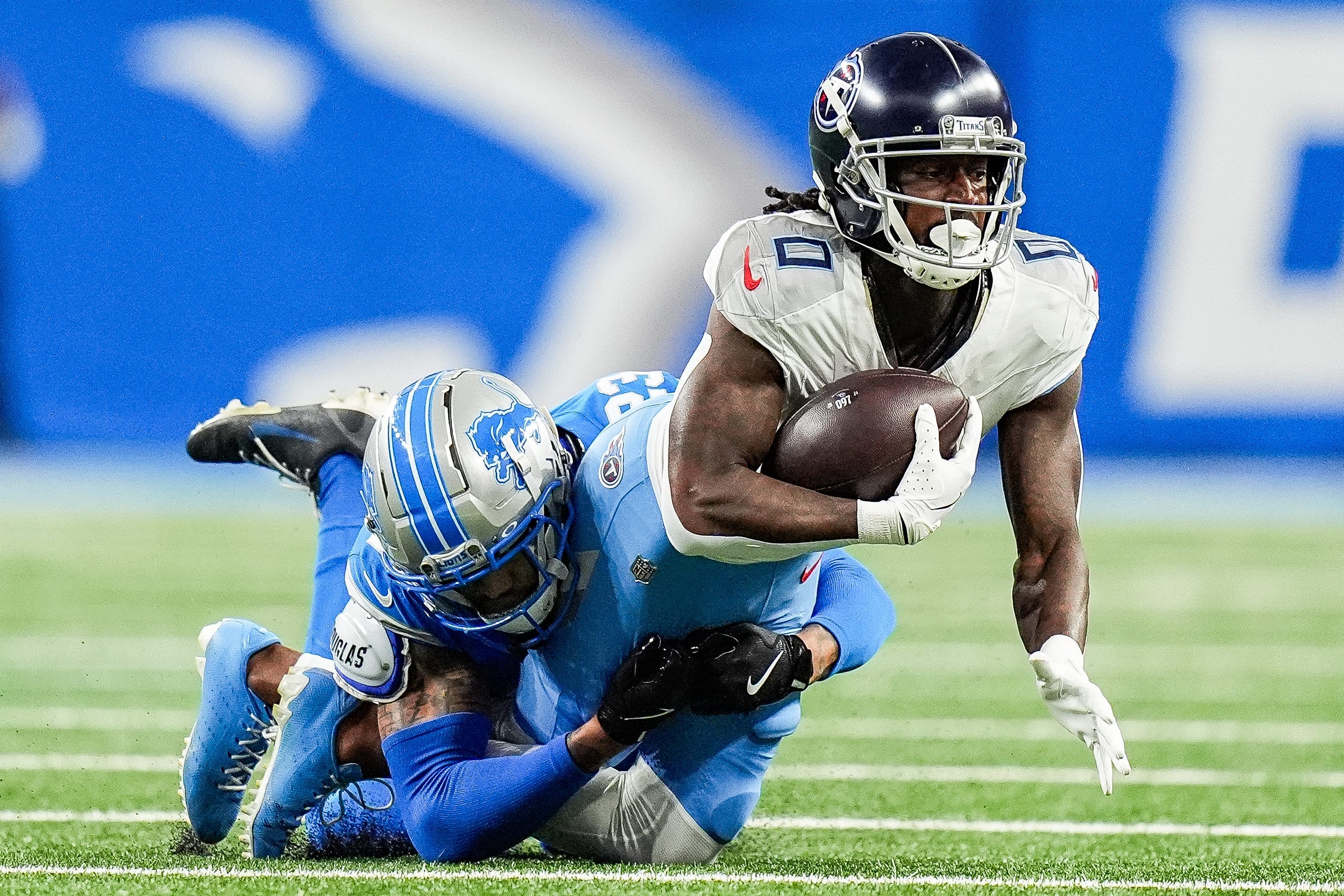 Tennessee Titans wide receiver Calvin Ridley (0) makes a catch against Detroit Lions cornerback Carlton Davis III (23) during the first half at Ford Field in Detroit on Sunday, Oct. 27, 2024 Junfu Han-USA TODAY NETWORK via Imagn Images