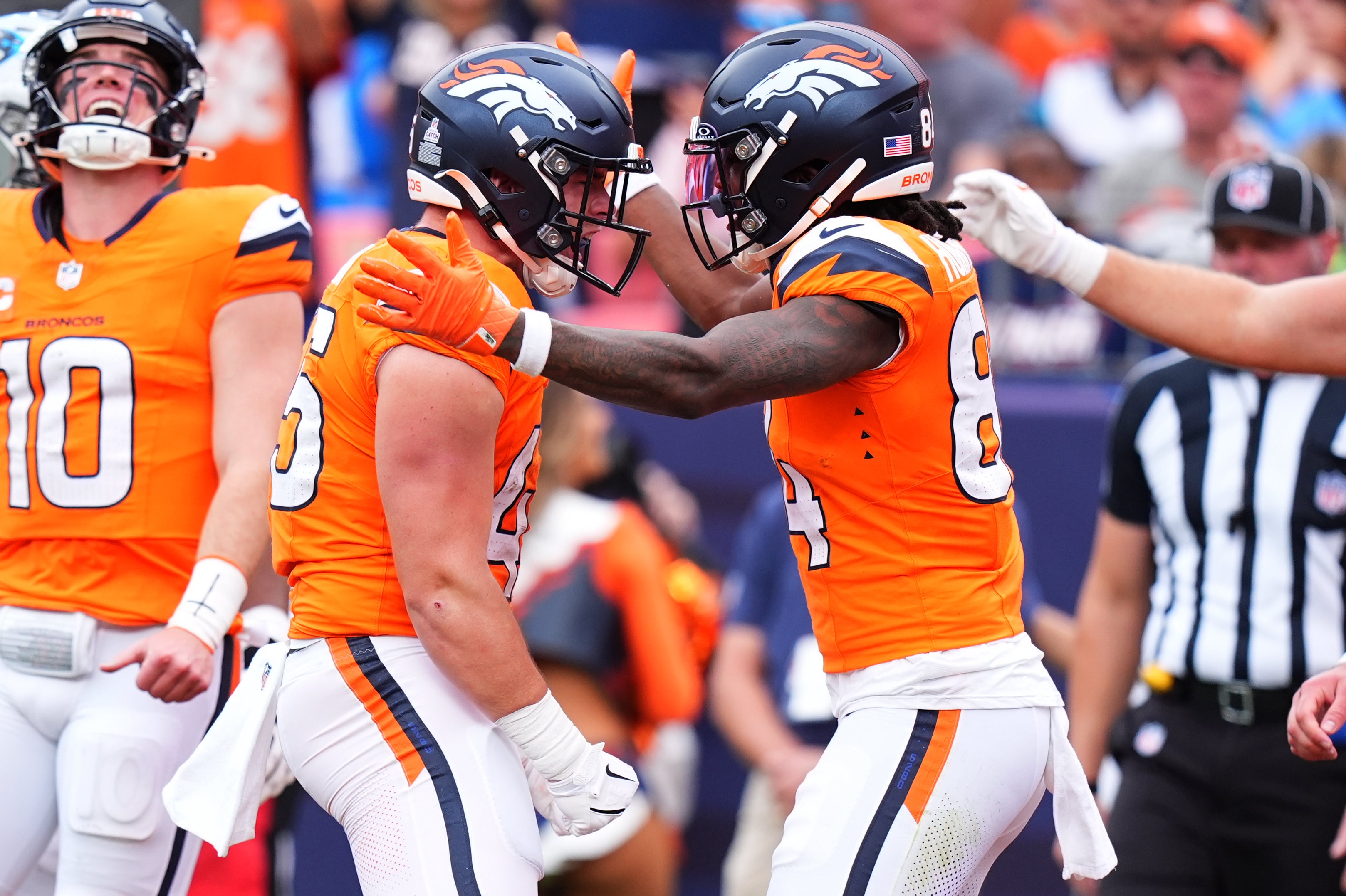 Broncos tight end Nate Adkins celebrates his touchdown with wide receiver Lil'Jordan Humphrey