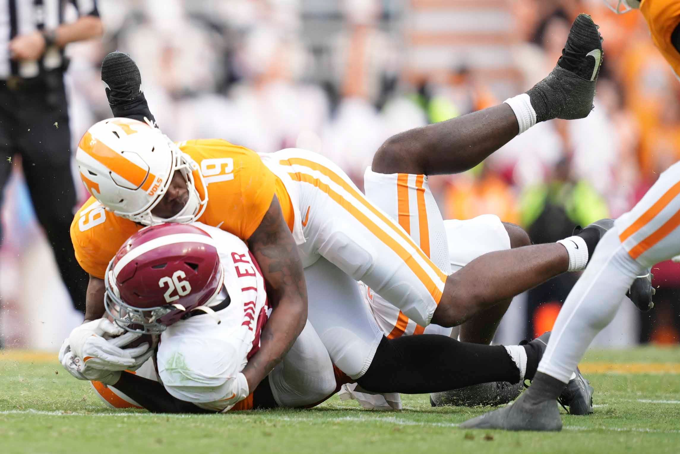 Tennessee defensive lineman Joshua Josephs (19) tackles Alabama running back Jam Miller (26) during a game between Tennessee and Alabama at Neyland Stadium in Knoxville, Tenn., Saturday, Oct. 19, 2024.