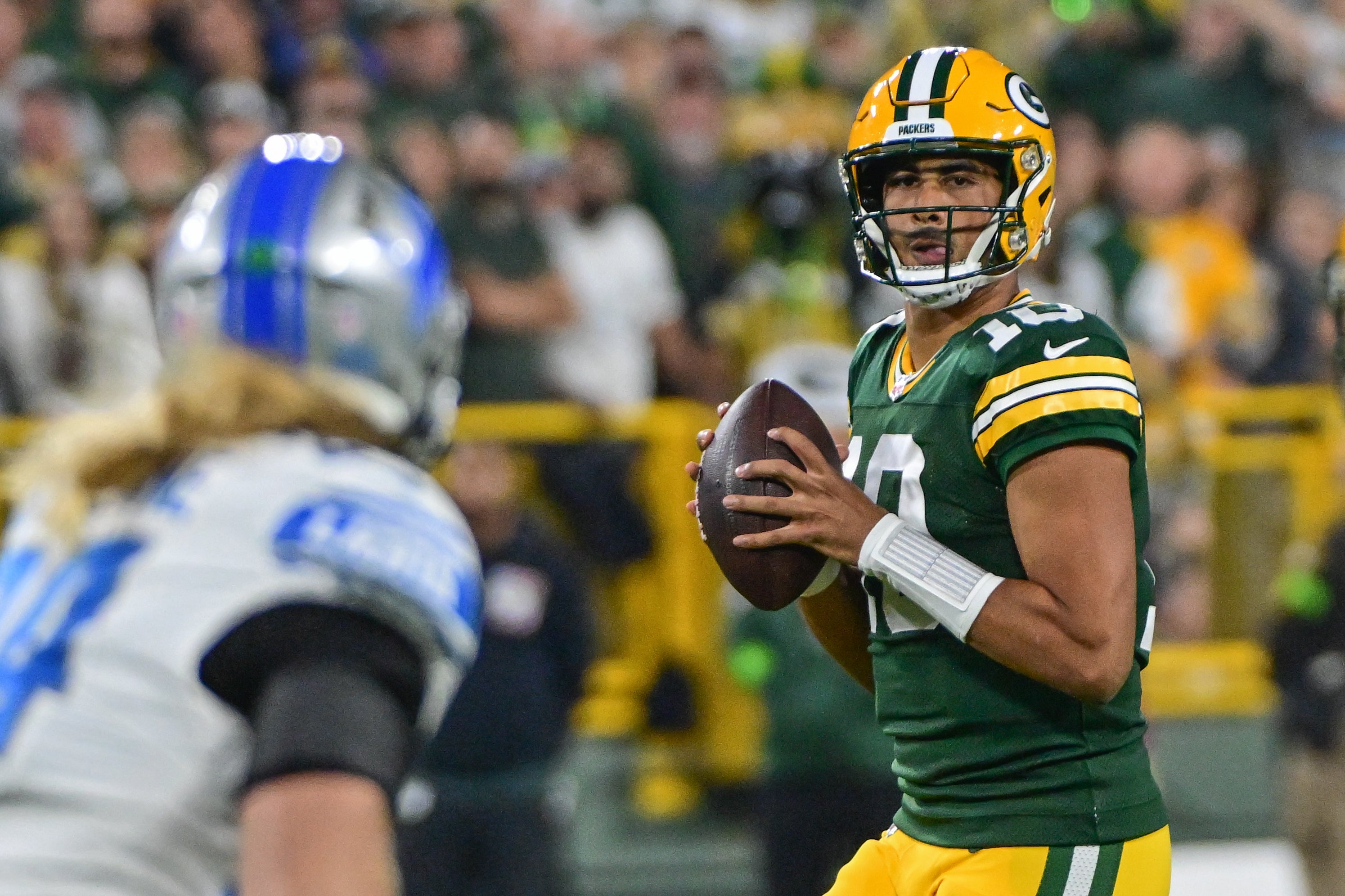 Green Bay Packers quarterback Jordan Love (10) drops back to pass in the first quarter against the Detroit Lions at Lambeau Field.
