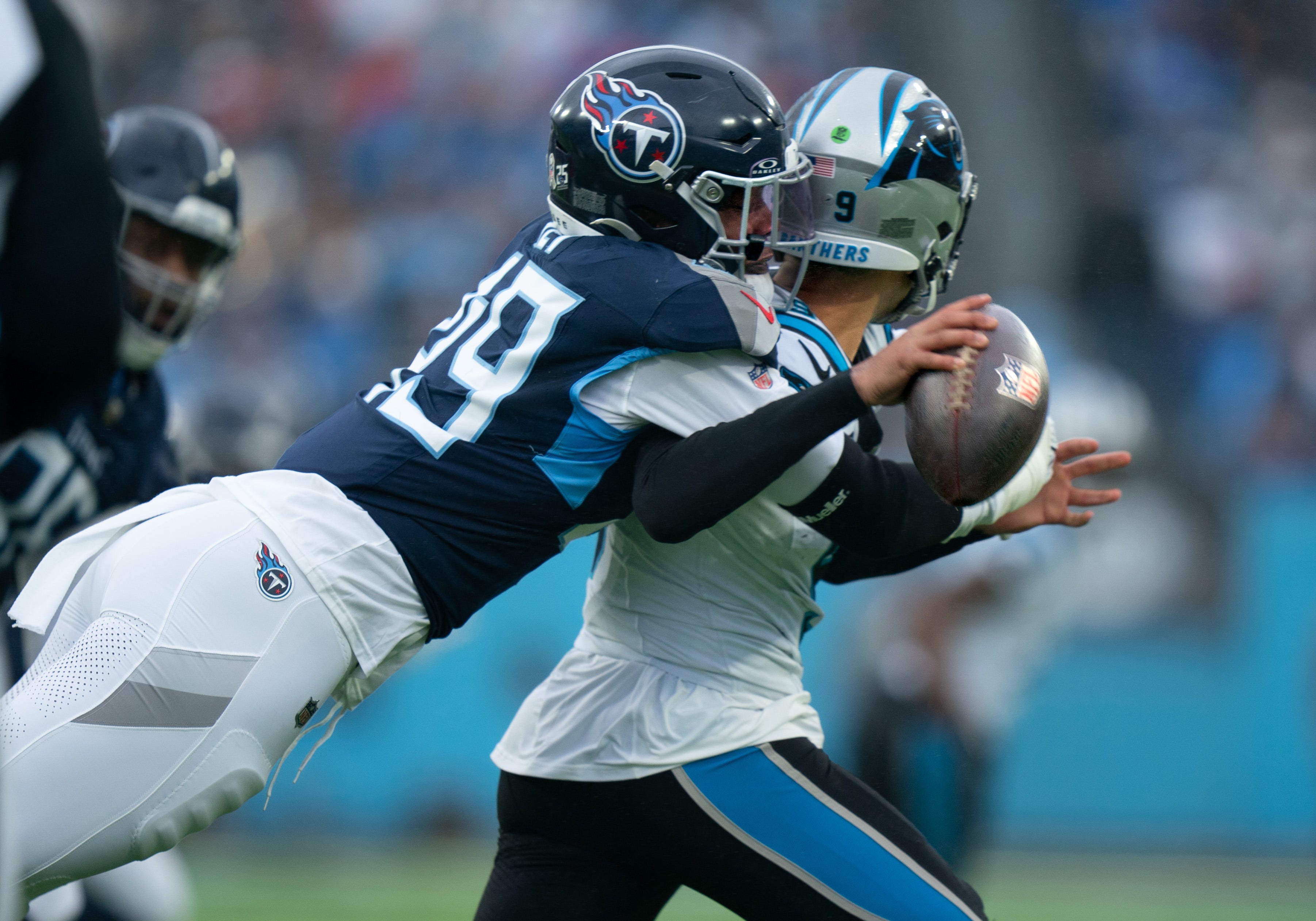 Tennessee Titans linebacker Arden Key (49) sacks Carolina Panthers quarterback Bryce Young (9) and created a fumble during their game at Nissan Stadium in Nashville, Tenn., Sunday, Nov. 26, 2023 Denny Simmons / The Tennessean-USA TODAY NETWORK