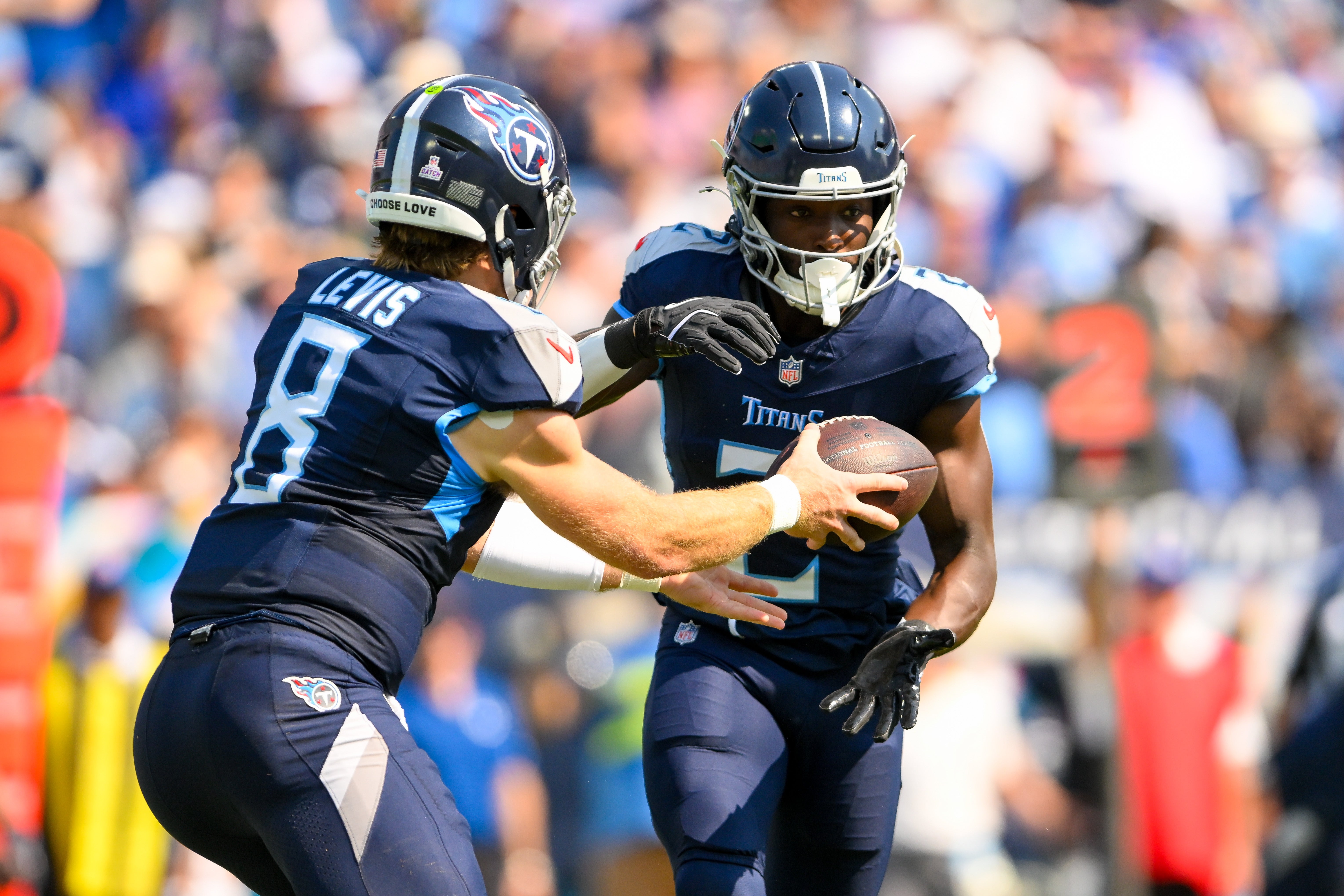 Tennessee Titans Will Levis (8) hands the ball to running back Tyjae Spears (2) against the Indianapolis Colts during the first half at Nissan Stadium. Steve Roberts-Imagn Images