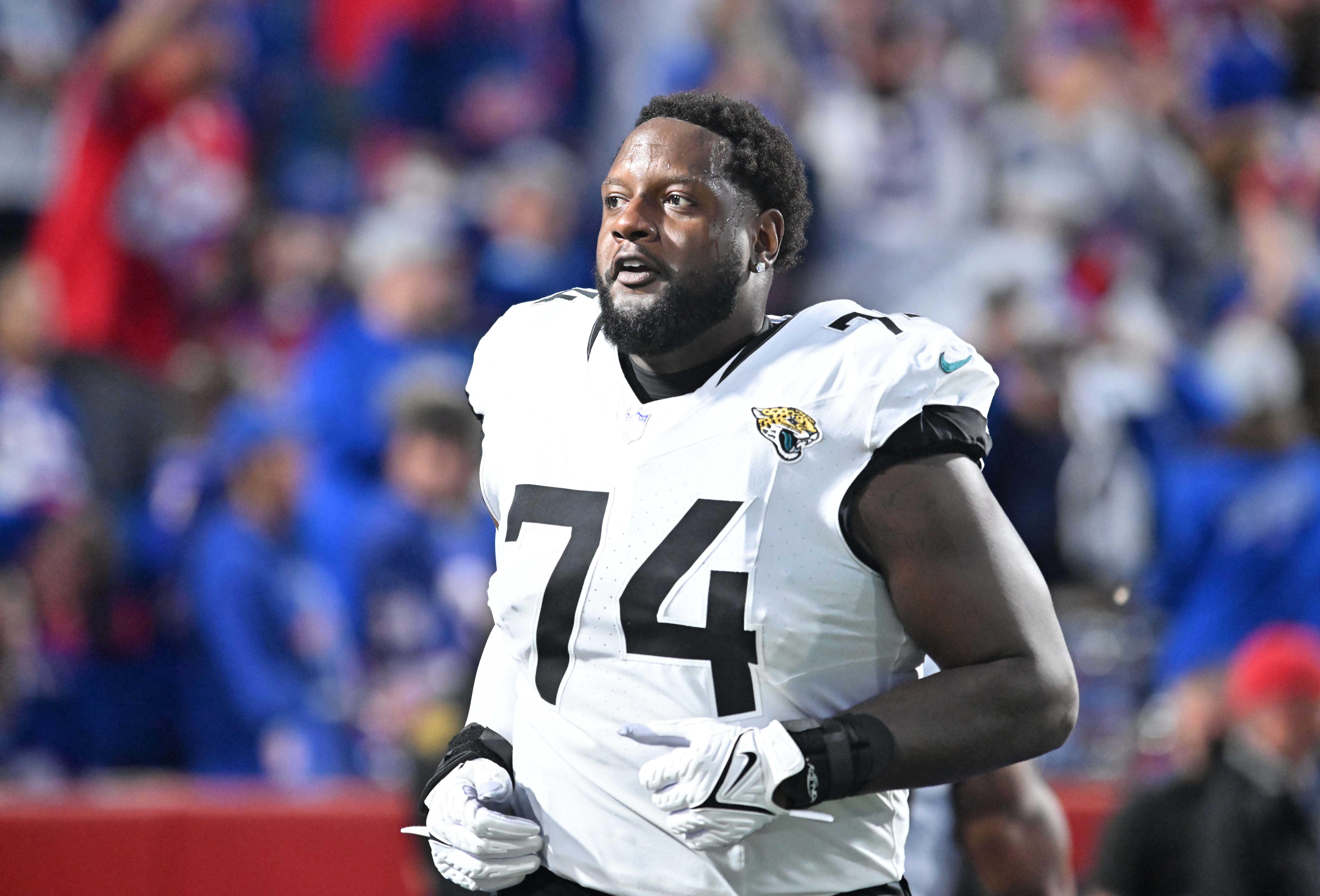 Sep 23, 2024; Orchard Park, New York, USA; Jacksonville Jaguars offensive tackle Cam Robinson (74) enters the field before a game against the Buffalo Bills at Highmark Stadium.