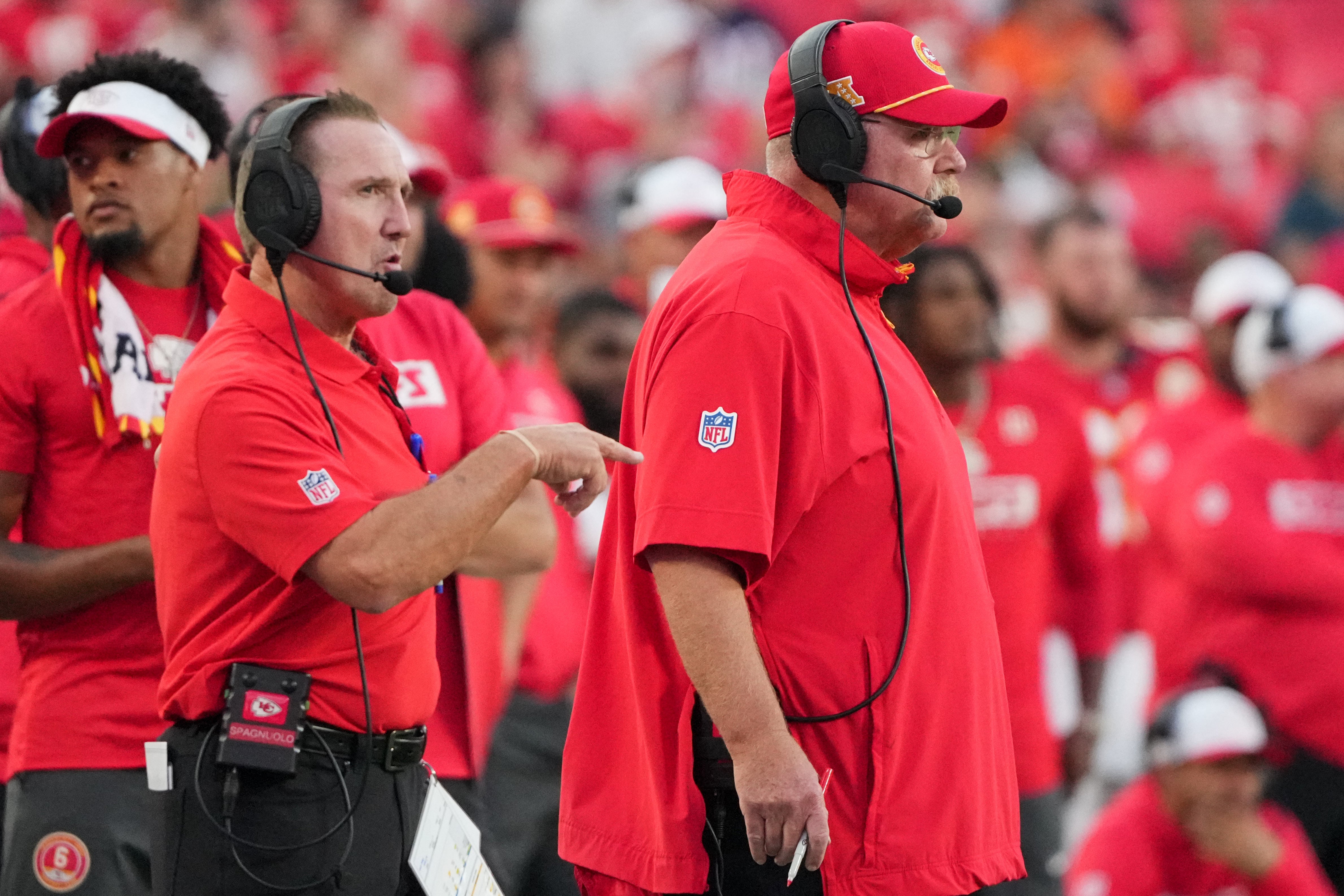Aug 22, 2024; Kansas City, Missouri, USA; Kansas City Chiefs defensive coordinator Steve Spagnuolo, left and head coach Andy Reid watch play against the Chicago Bears during the game at GEHA Field at Arrowhead Stadium.