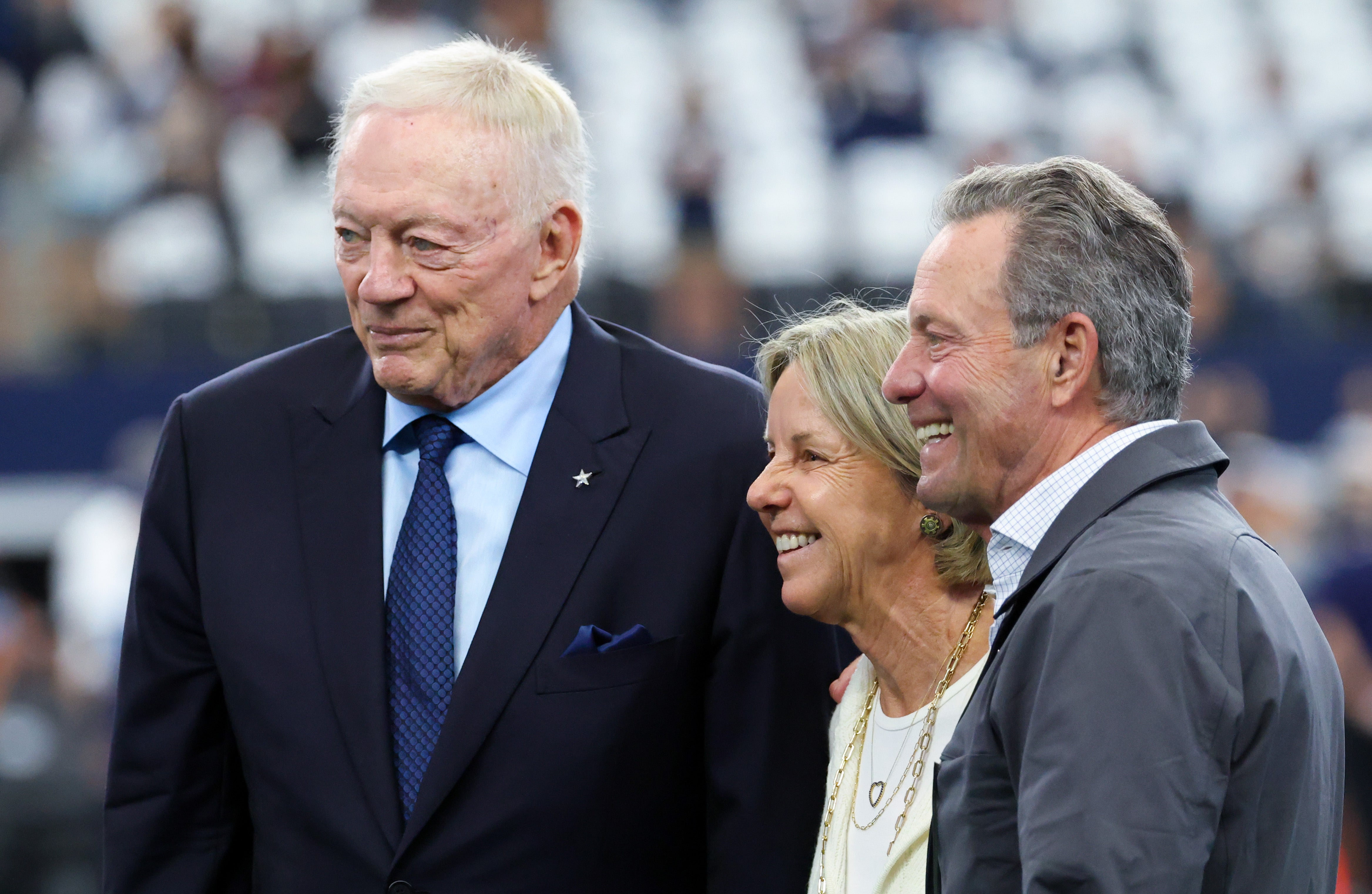 Dallas Cowboys owner Jerry Jones (left) takes a photo with Detroit Lions owner Sheila Ford Hamp and her husband Steve before the game at AT&T Stadium.