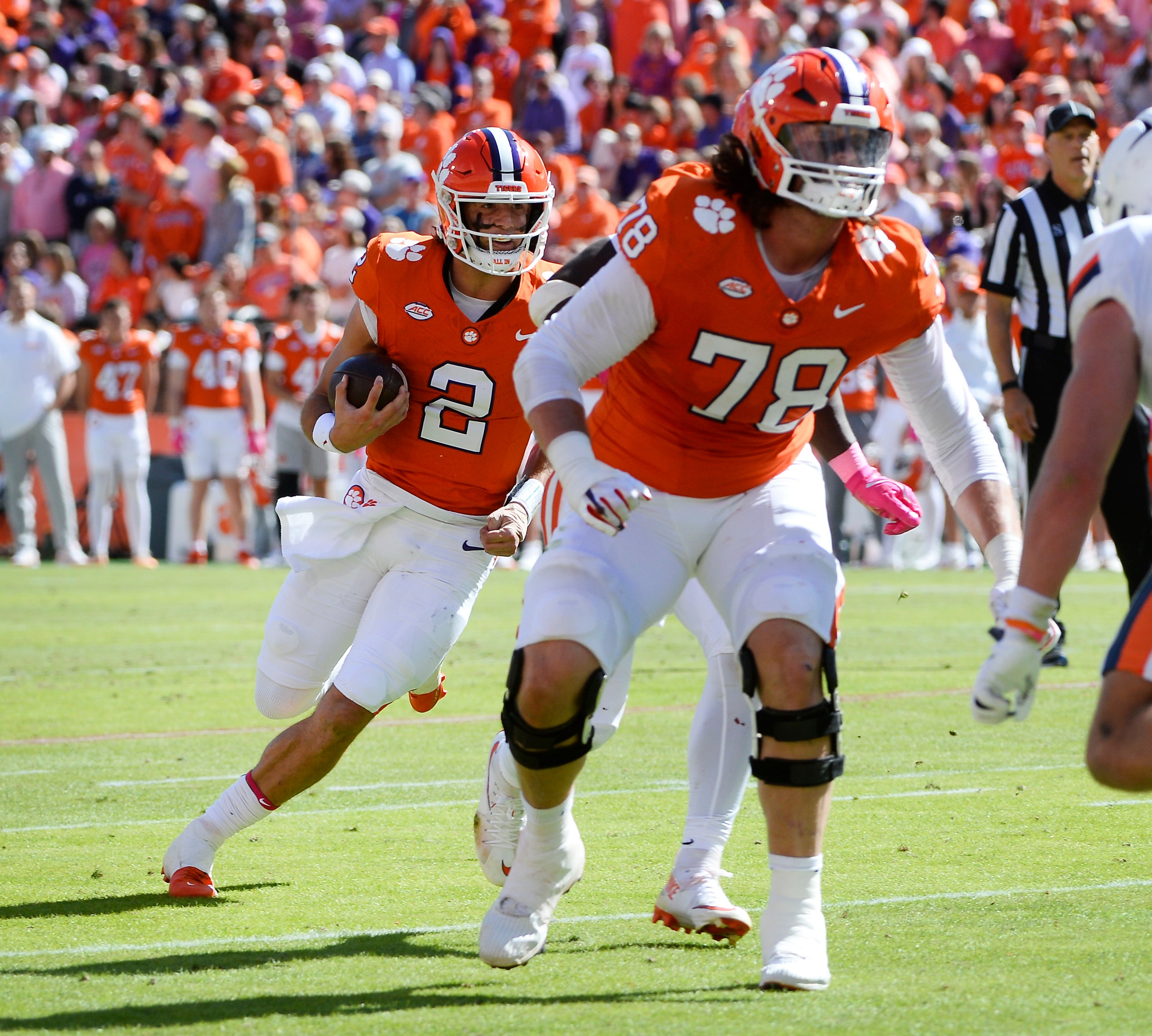 Clemson Tigers quarterback Cade Klubnik (2) follows offensive lineman Blake Miller (78) block down field against the Virginia Cavaliers at Memorial Stadium.