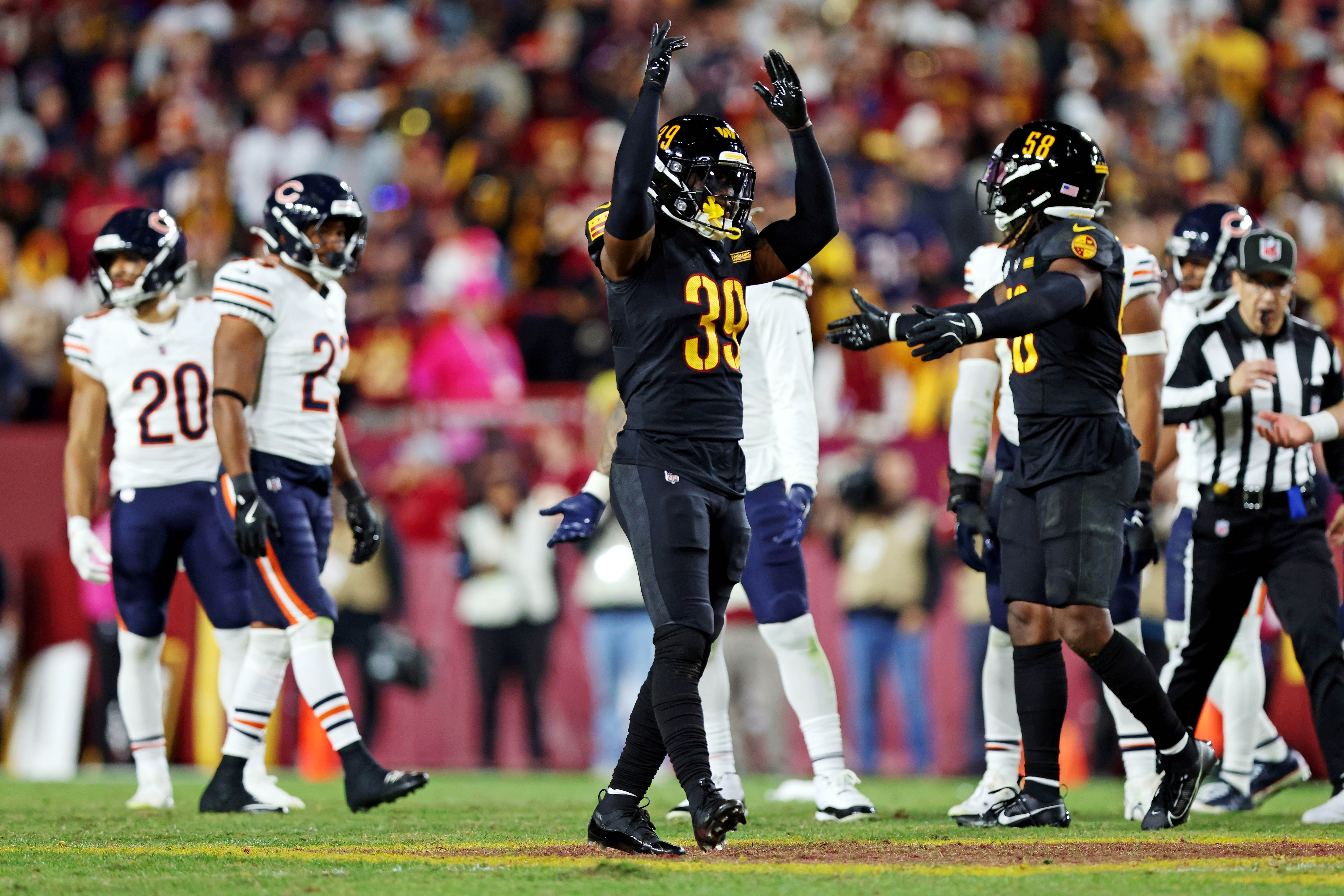 Oct 27, 2024; Landover, Maryland, USA; Washington Commanders safety Jeremy Reaves (39) reacts during the fourth quarter against the Chicago Bears at Commanders Field.