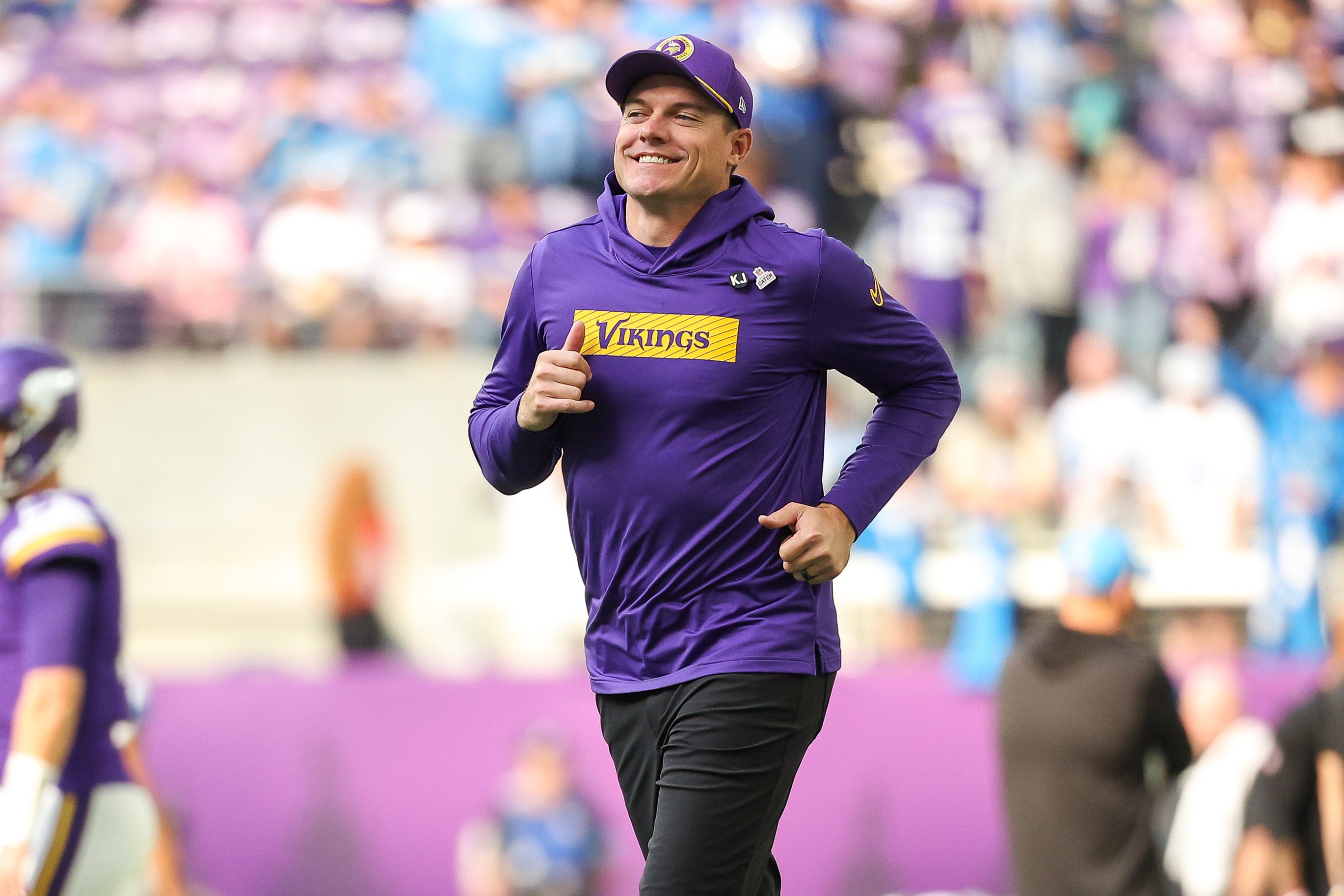 Oct 20, 2024; Minneapolis, Minnesota, USA; Minnesota Vikings head coach Kevin O'Connell runs on the field before the game against the Detroit Lions at U.S. Bank Stadium.