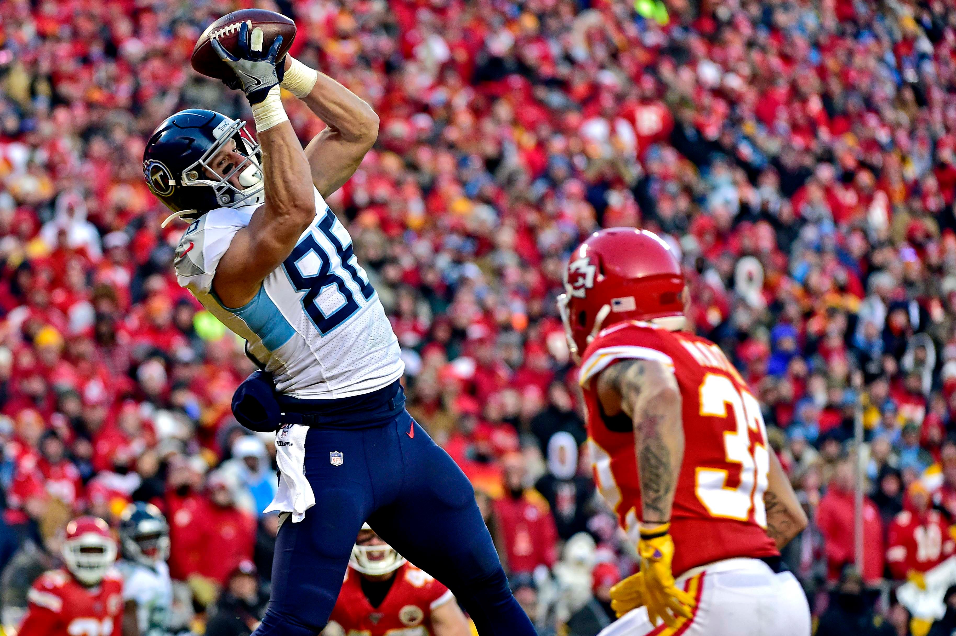 Jan 19, 2020; Kansas City, Missouri, USA; Tennessee Titans tight end Anthony Firkser (86) catches a touchdown pass against Tennessee Titans running back David Fluellen (32) during the second half in the AFC Championship Game at Arrowhead Stadium.