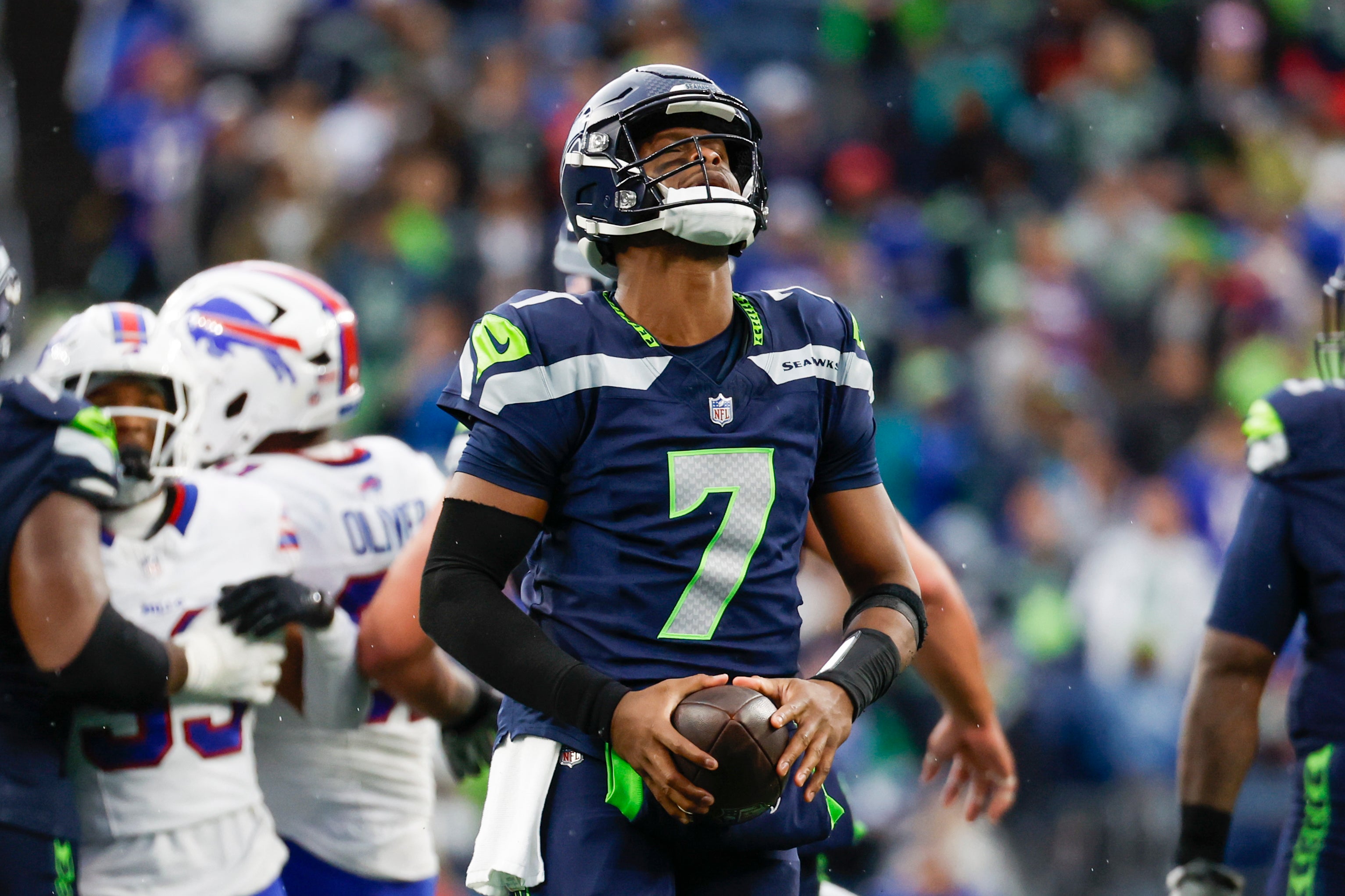 Seattle Seahawks quarterback Geno Smith (7) reacts after a delay of game penalty following a fourth quarter timeout against the Buffalo Bills at Lumen Field.