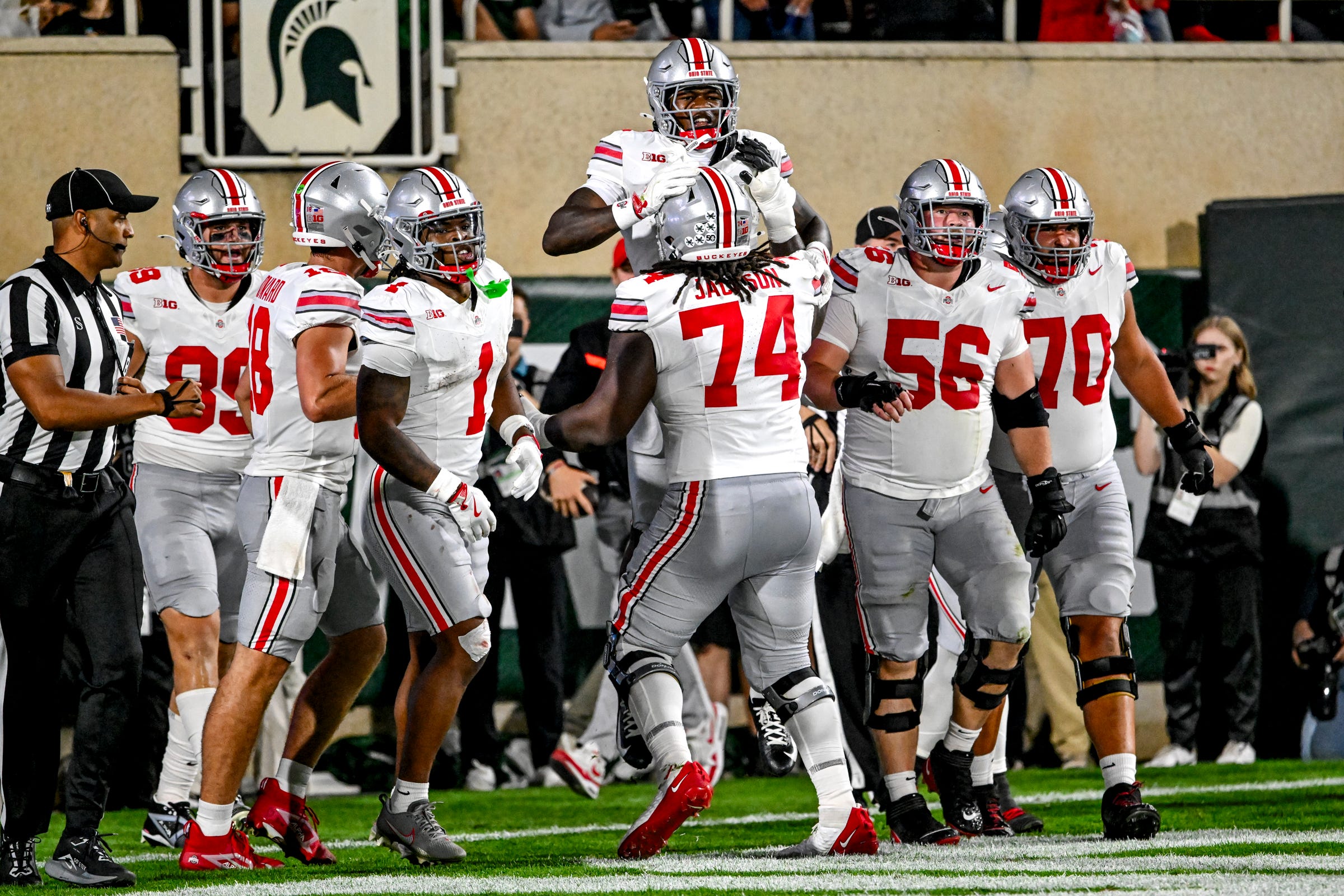 Ohio State's Jeremiah Smith, top, is lifted by teammate Donovan Jackson after Smith's touchdown against Michigan State during the second quarter on Saturday, Sept. 28, 2024, at Spartan Stadium in East Lansing.