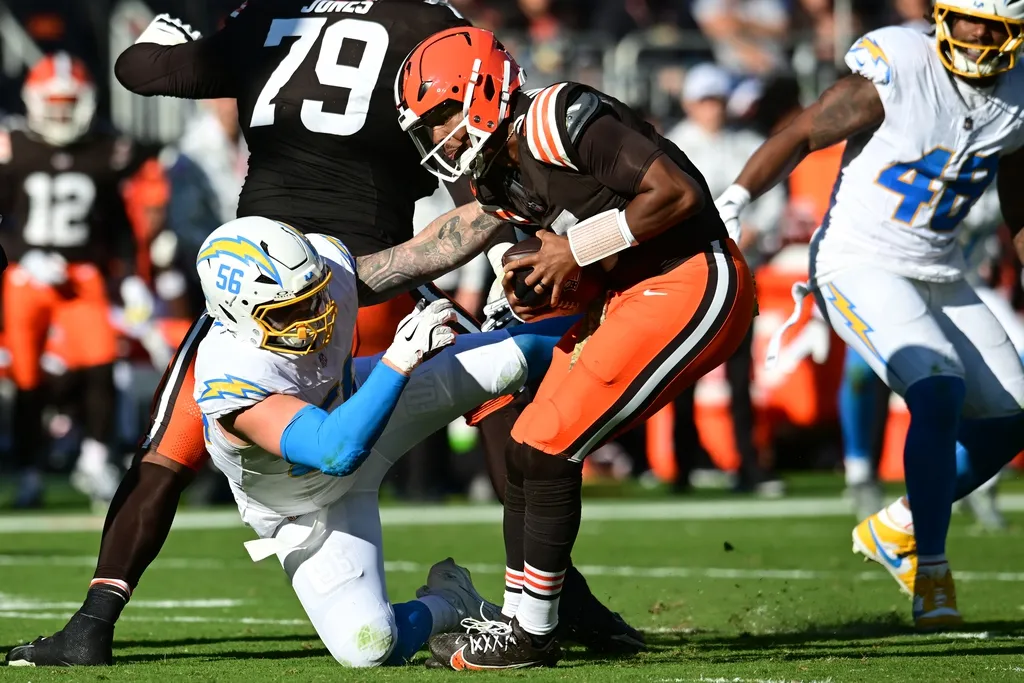 Los Angeles Chargers defensive end Morgan Fox (56) attempts to tackles Cleveland Browns quarterback Jameis Winston (5) during the first half at Huntington Bank Field.