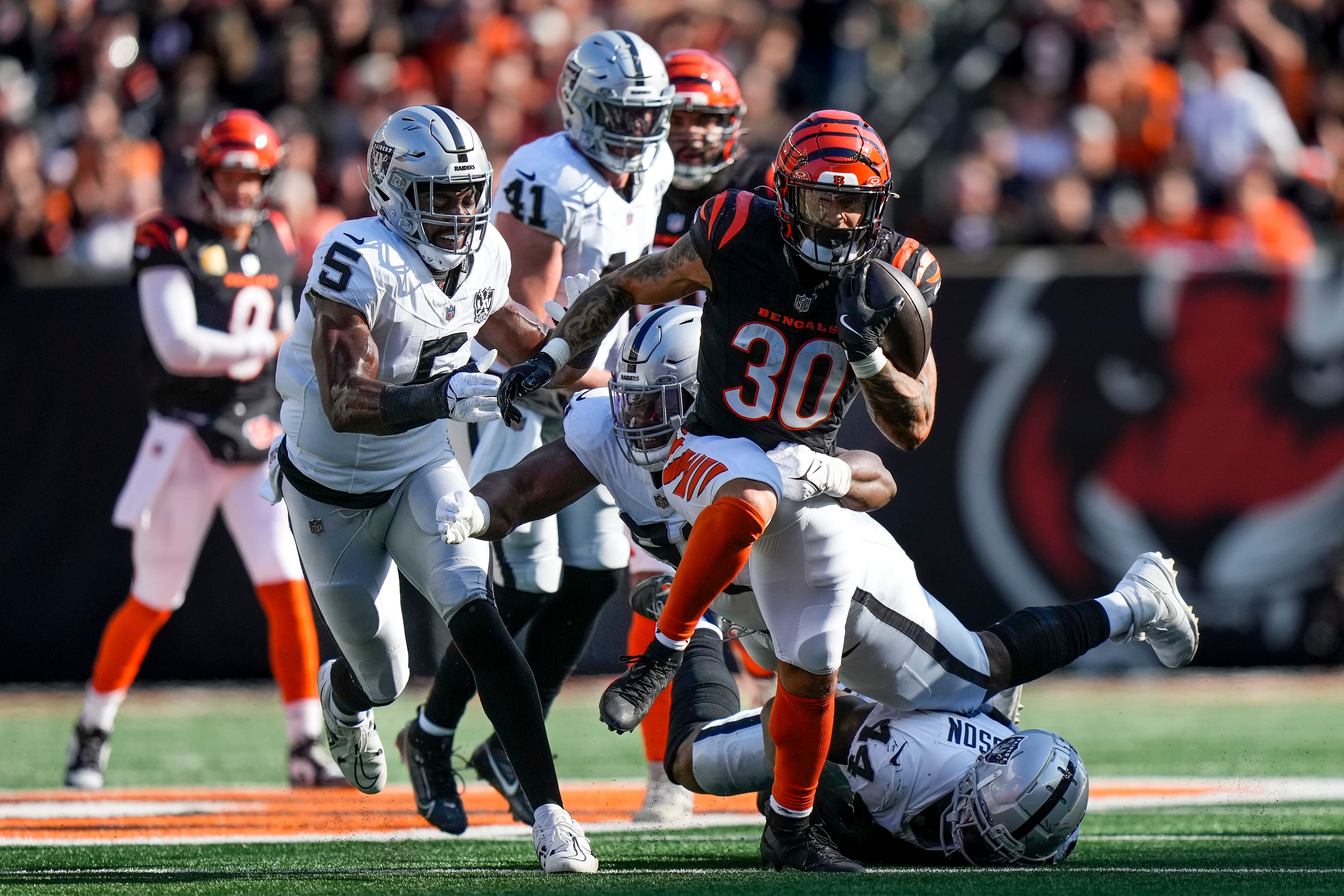 Cincinnati Bengals running back Chase Brown (30) breaks away with a the ball in the second quarter of the NFL Week 9 game between the Cincinnati Bengals and the Las Vegas Raiders at Paycor Stadium in downtown Cincinnati on Sunday, Nov. 3, 2024.