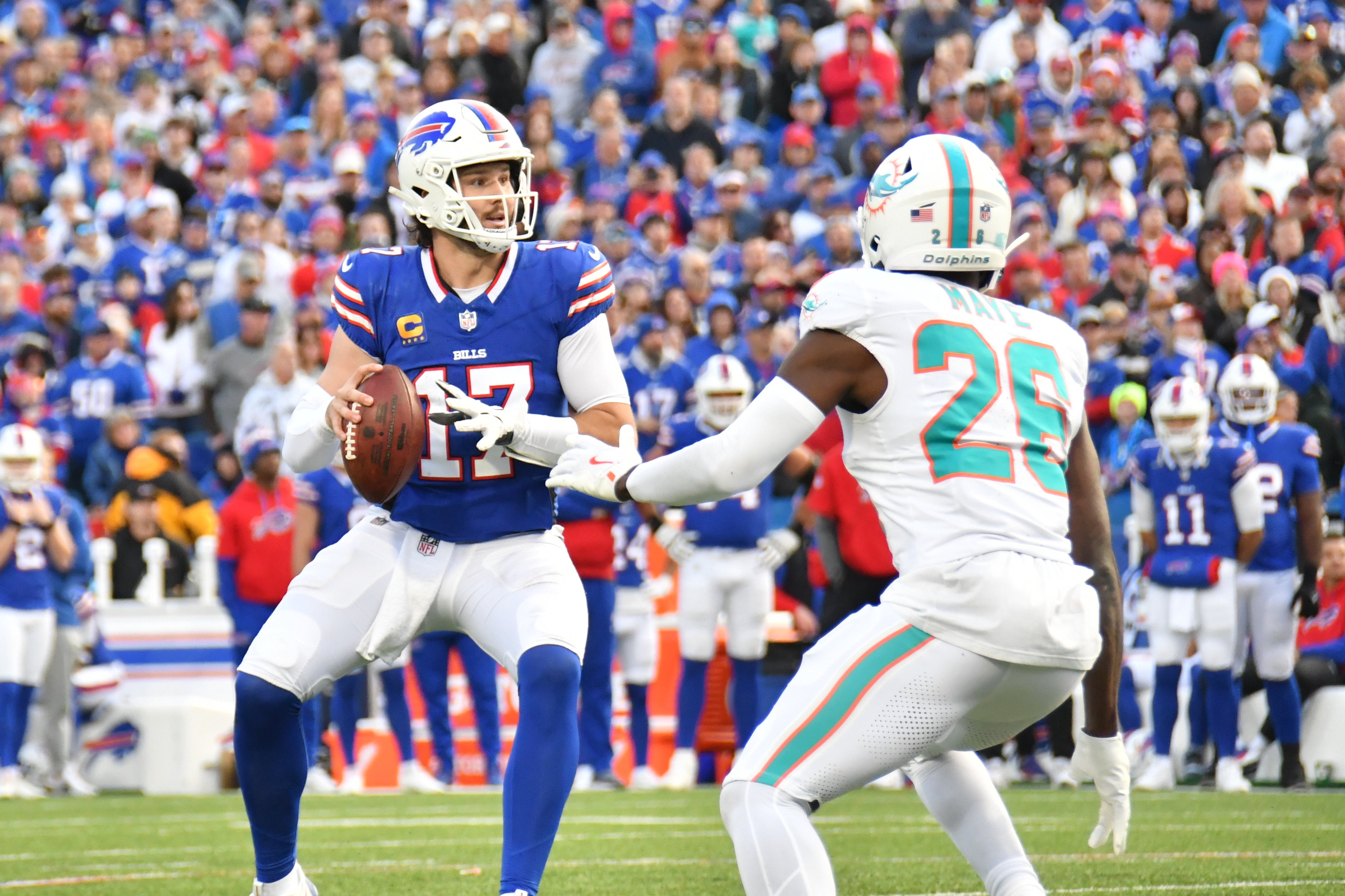 Nov 3, 2024; Orchard Park, New York, USA; Buffalo Bills quarterback Josh Allen (17) looks to throw a pass as Miami Dolphins safety Marcus Maye (26) gives pressure in the fourth quarter at Highmark Stadium.