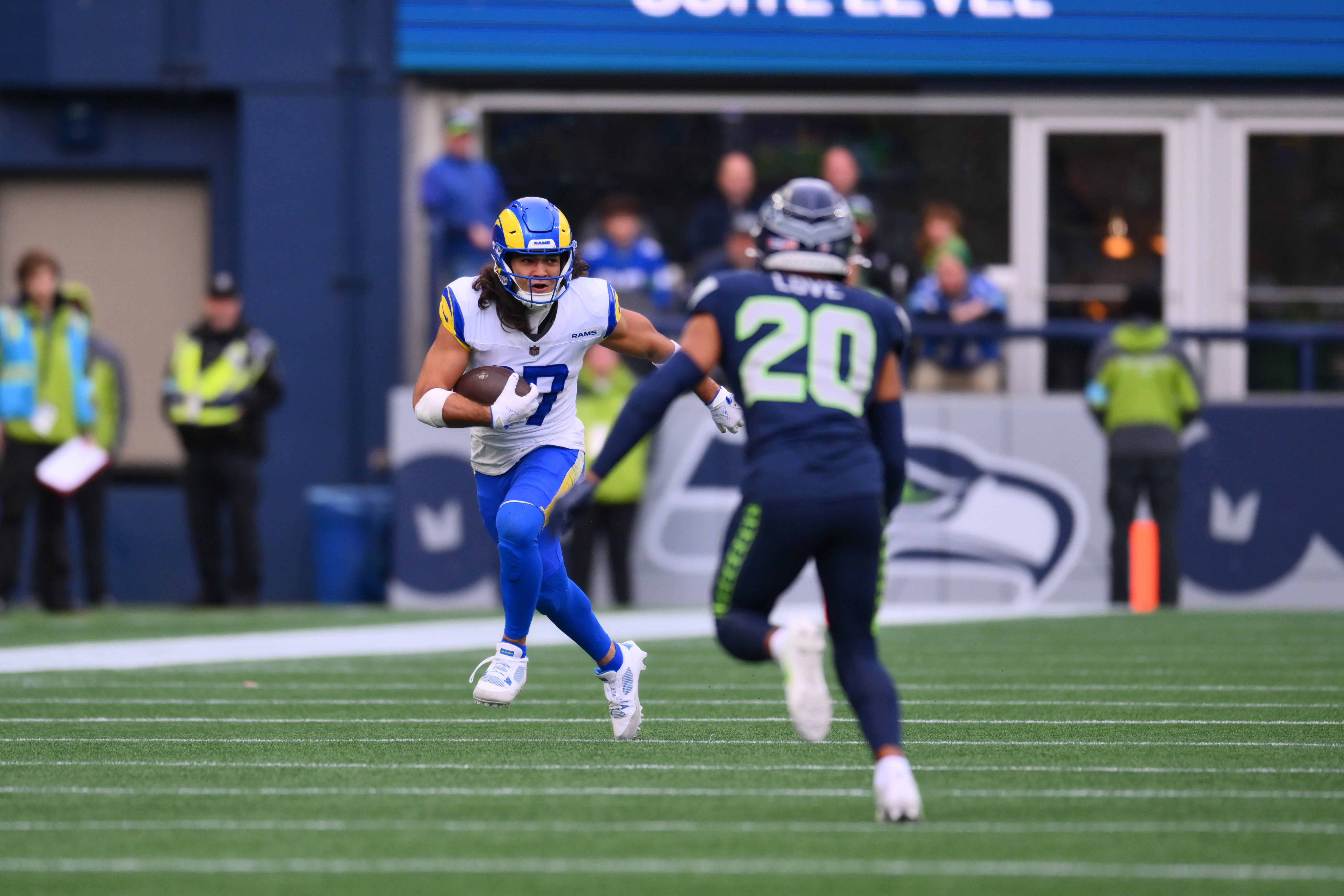 Los Angeles Rams wide receiver Puka Nacua (17) carries the ball after a catch against the Seattle Seahawks during the first half at Lumen Field.
