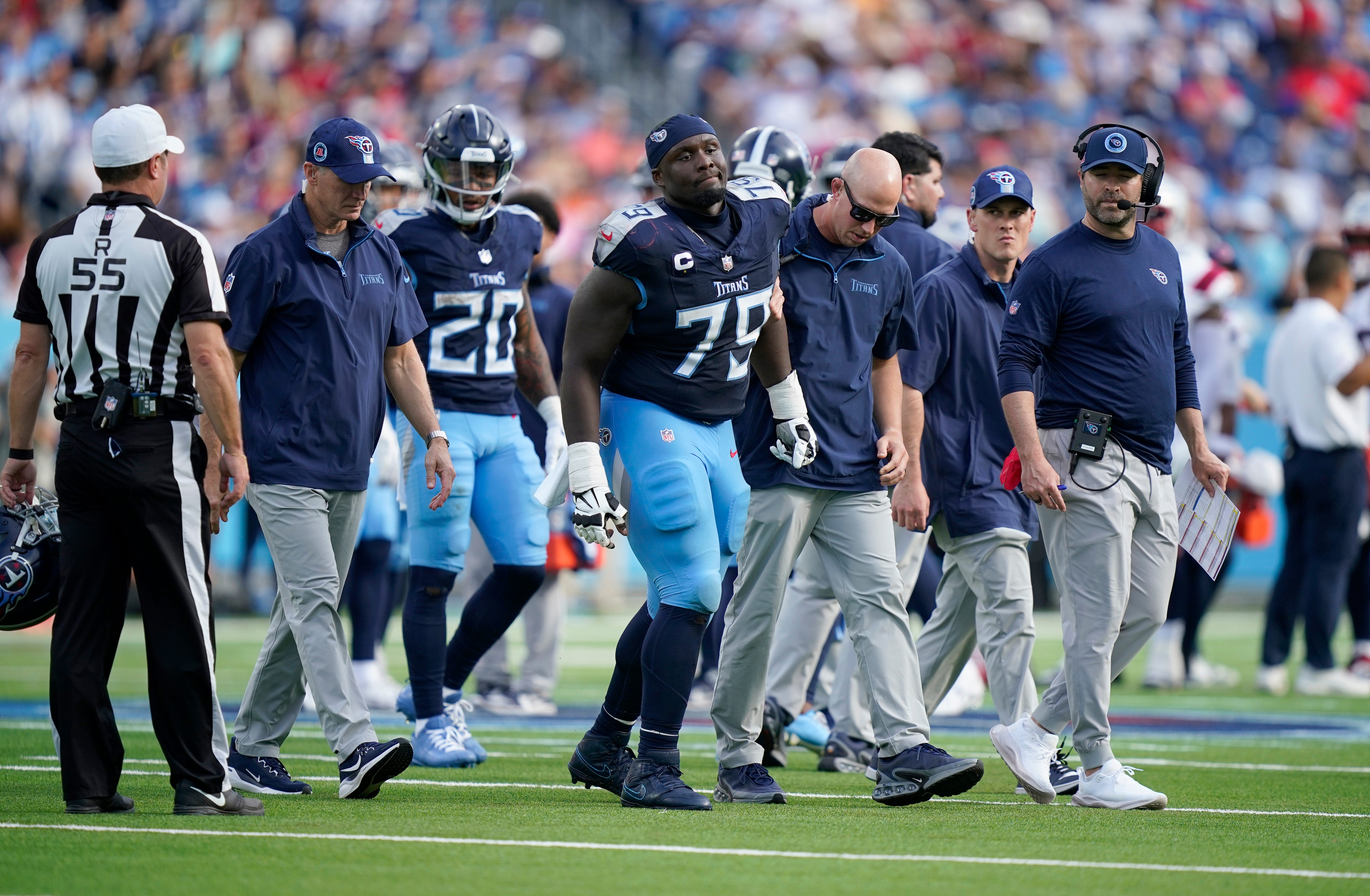 Tennessee Titans center Lloyd Cushenberry III (79) limps off the field at Nissan Stadium in Nashville, Tenn., Sunday, Nov. 3, 2024.