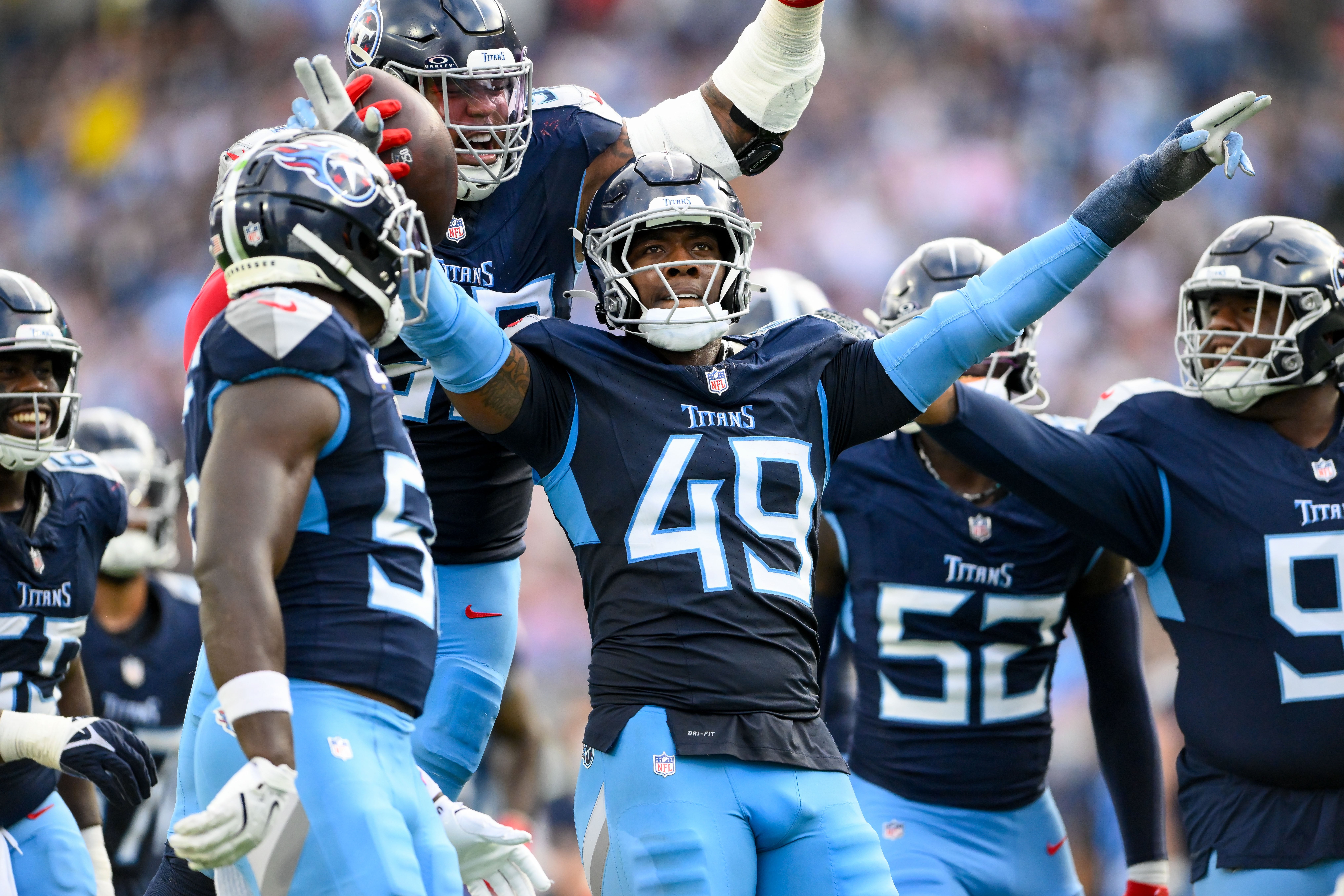 Nov 3, 2024; Nashville, Tennessee, USA; Tennessee Titans linebacker Arden Key (49) celebrates the strip sack and fumble recovery against the New England Patriots during the second half at Nissan Stadium. Mandatory Credit: Steve Roberts-Imagn Images