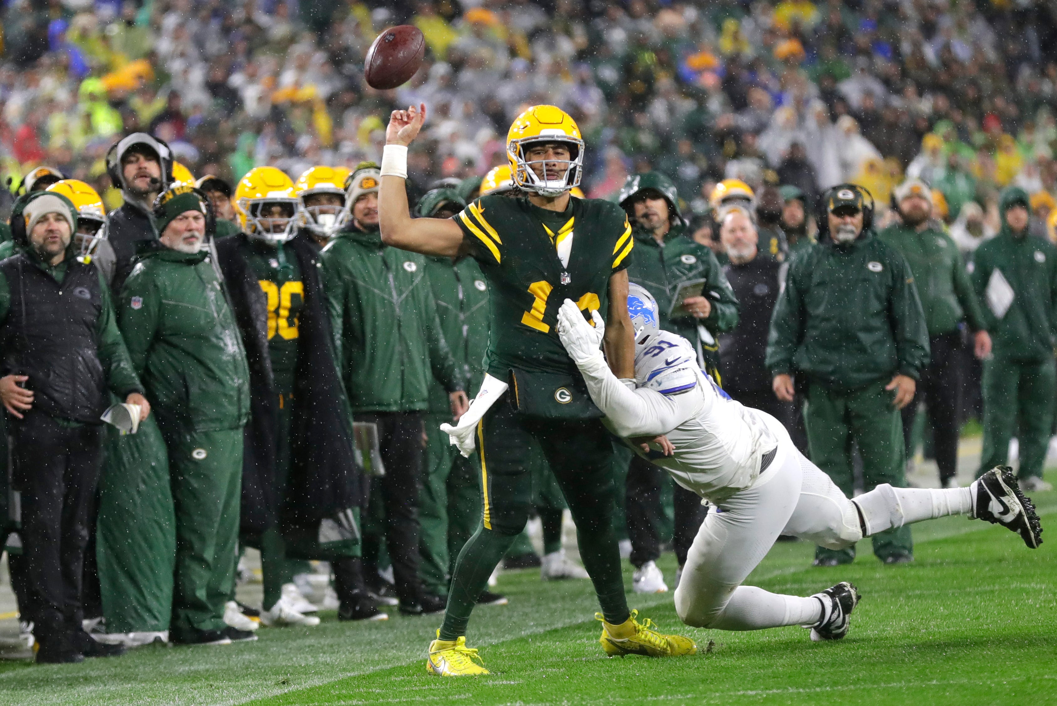 Green Bay Packers quarterback Jordan Love (10) throws an incomplete pass late in the fourth quarter under pressure from Detroit Lions defensive end Levi Onwuzurike (91) during their football game Sunday, November 3, 2024, at Lambeau Field in Green Bay, Wisconsin.