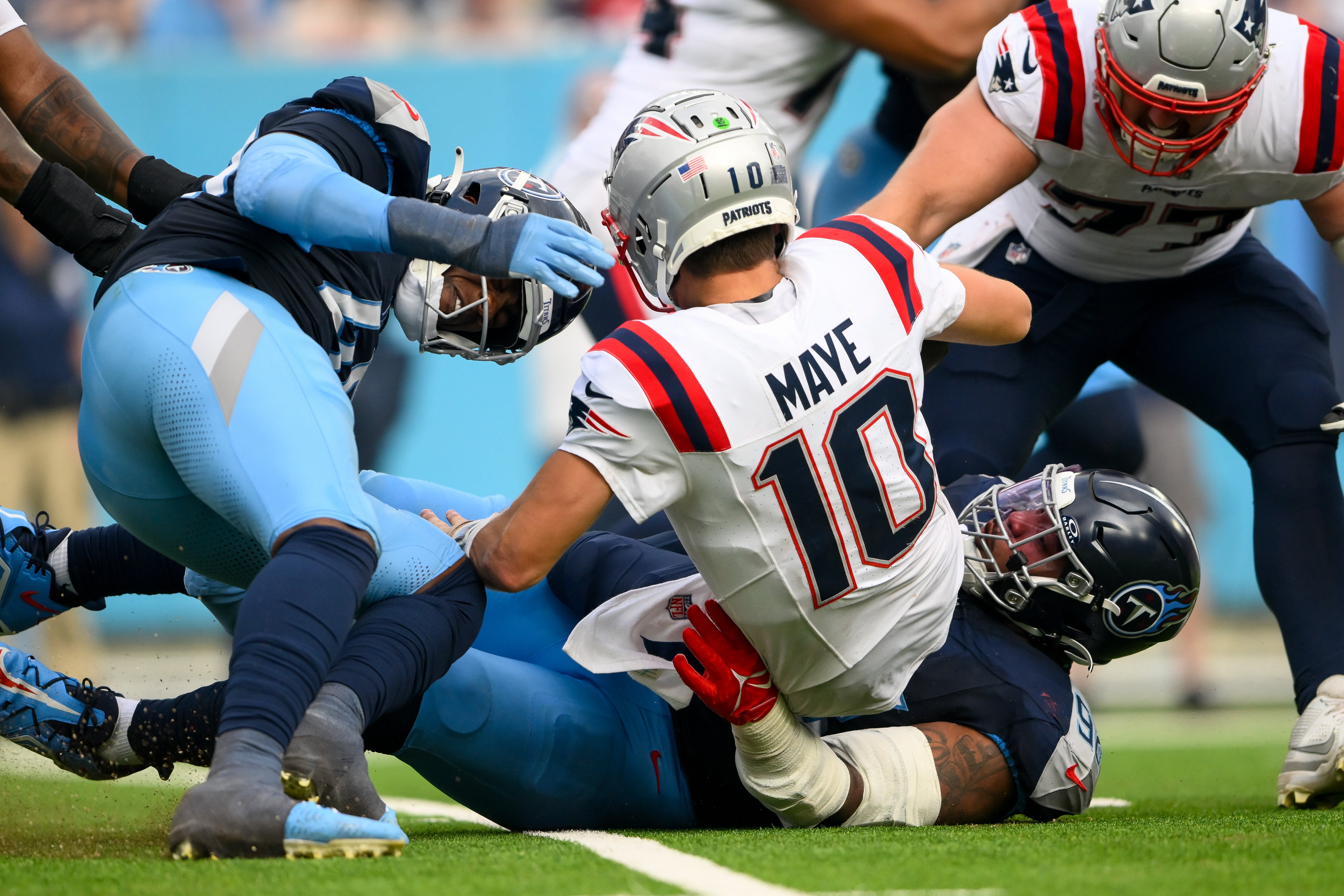 Nov 3, 2024; Nashville, Tennessee, USA; Tennessee Titans defensive tackle Jeffery Simmons (98) sacks New England Patriots quarterback Drake Maye (10) during the second half at Nissan Stadium.
