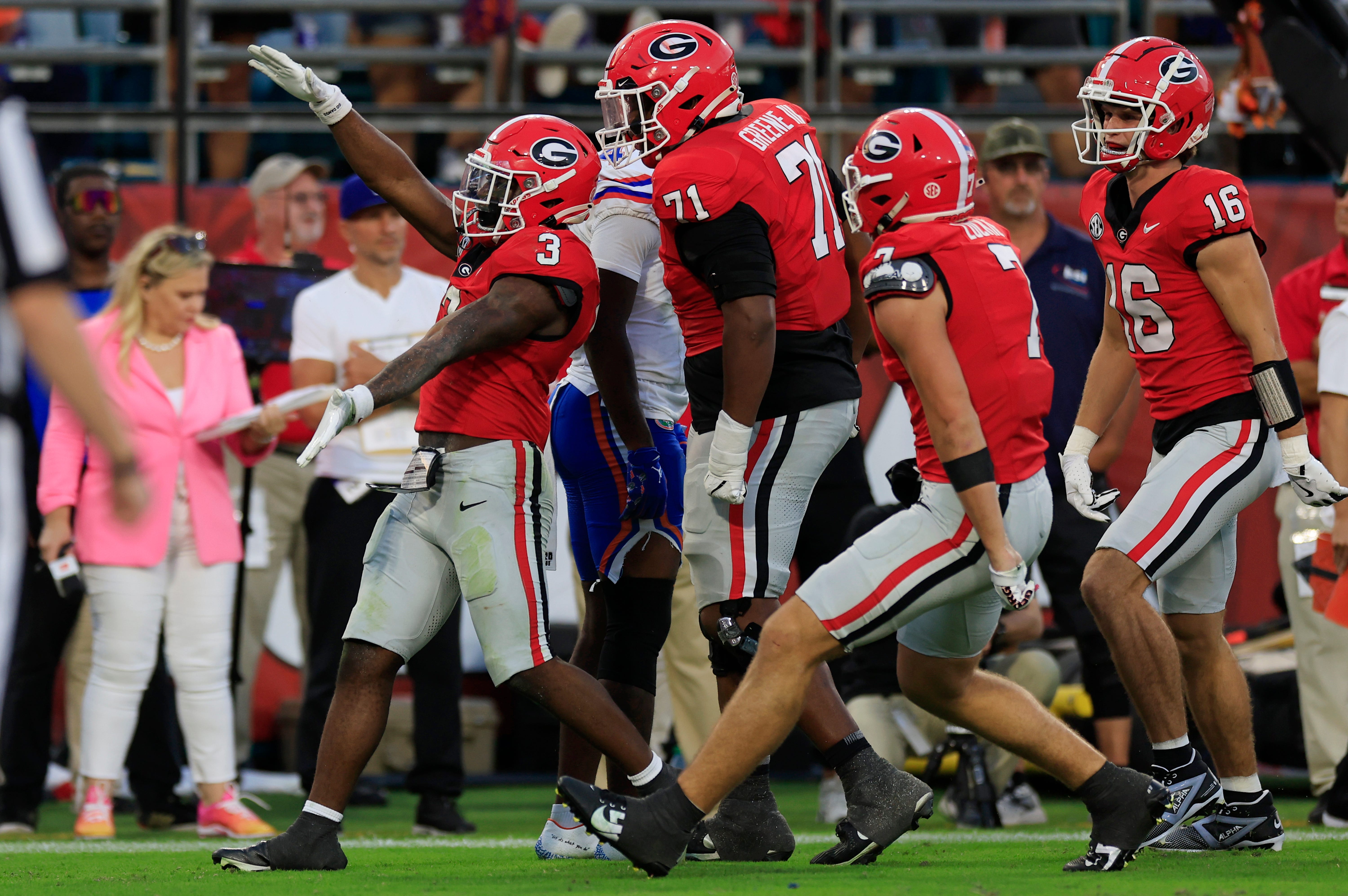 Georgia Bulldogs running back Nate Frazier (3) reacts to his touchdown that caused a penalty for unsportsmanlike conduct with the Gator Chomp during the third quarter of an NCAA college football match.